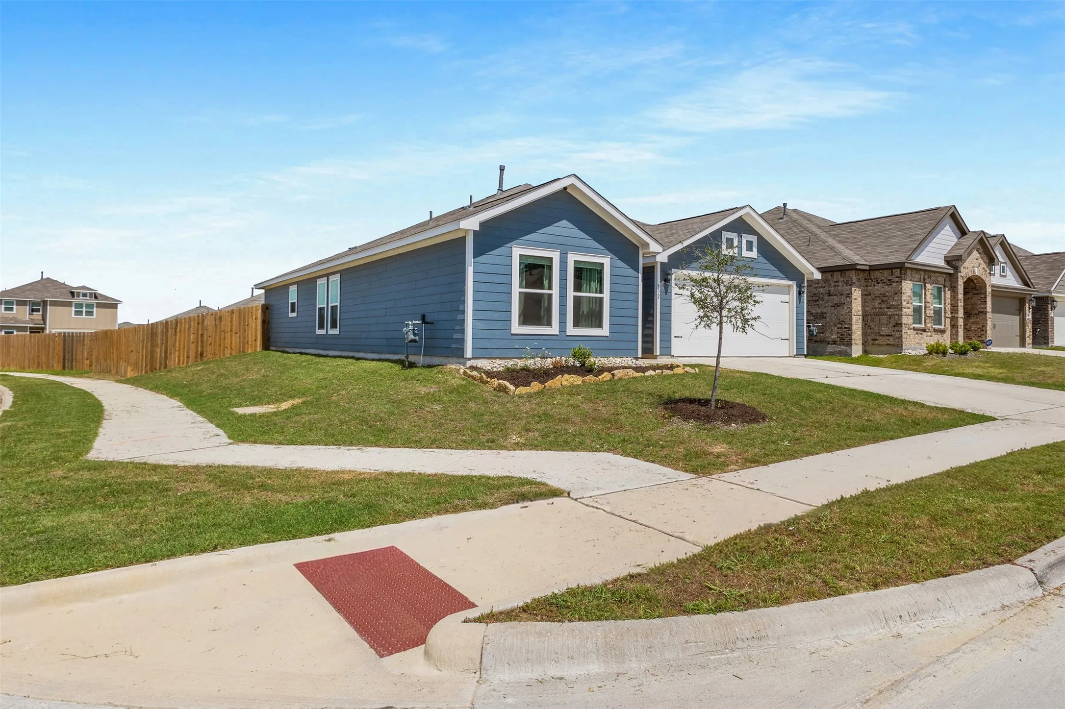 Single-story residence featuring blue siding and a white trim