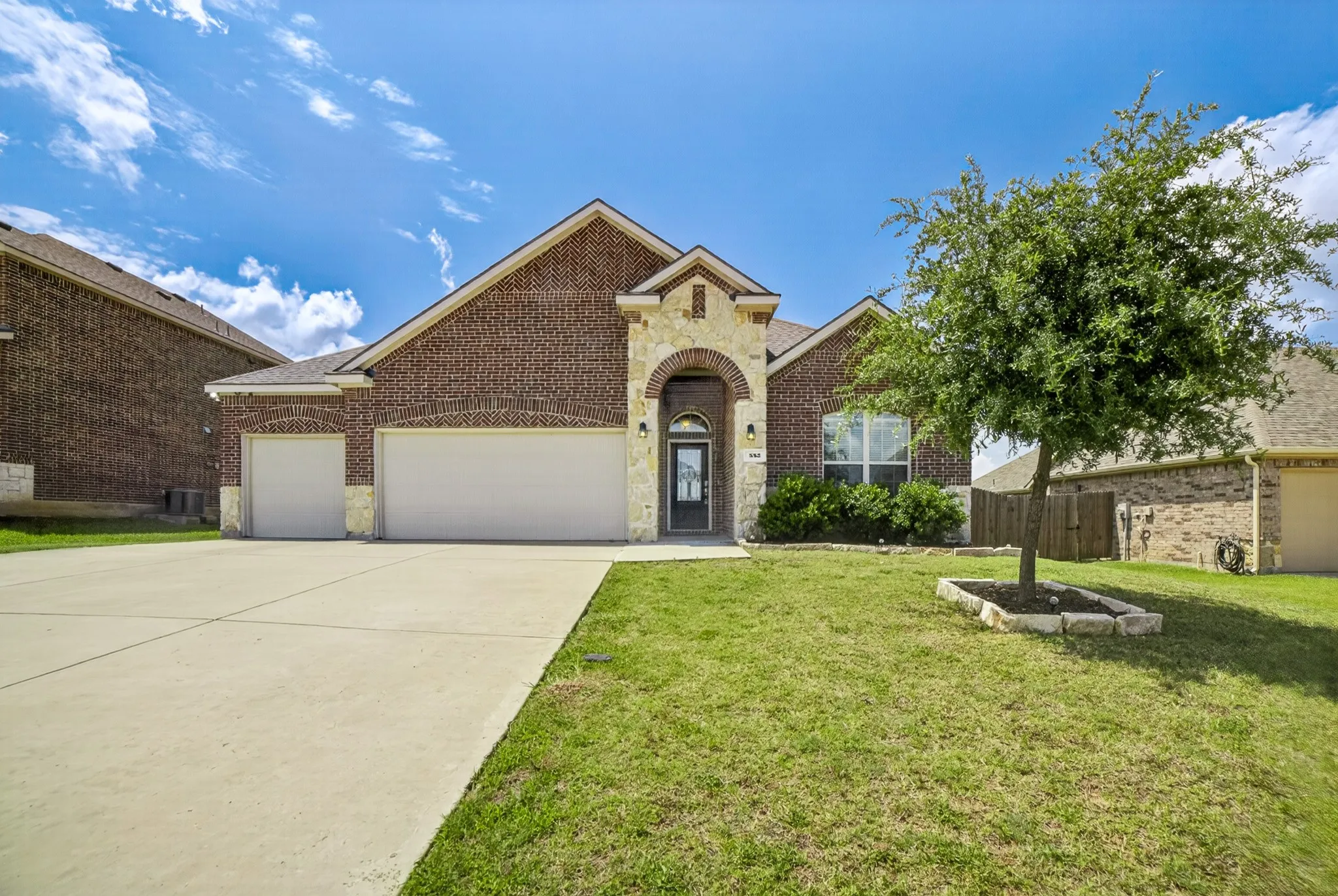 552 Winnetka Dr, Oak Pt. located on peninsula in Woodridge Estates in far back of subdivision on a big 1/4 acre lot. Brick and stone fascia, covered entry, stone bordered flowerbed & tree with solar accent lights for night.