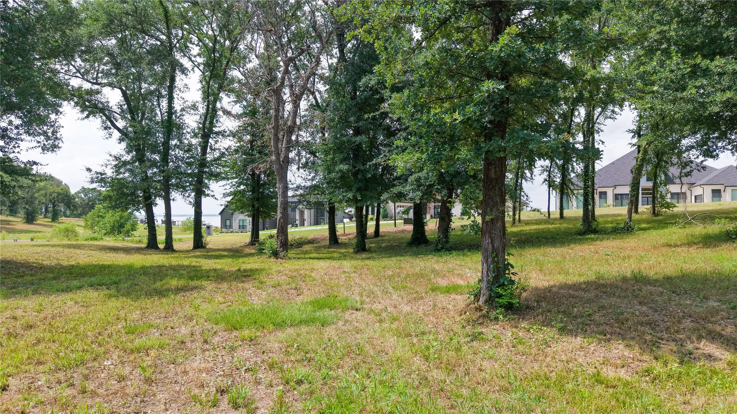 Spacious lot with access to community pool, marina, and boat launch.