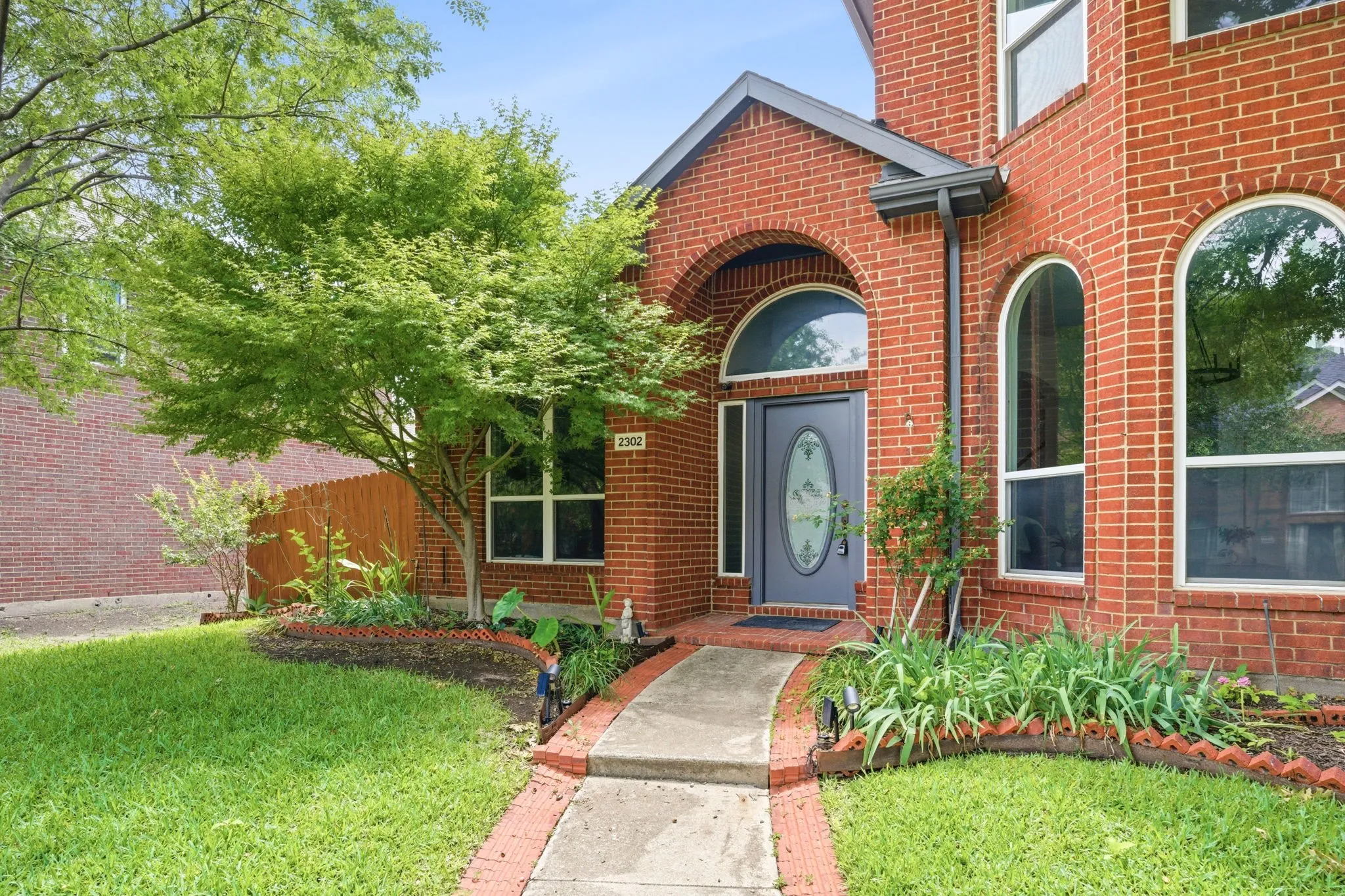 Red brick exterior with timeless arched windows