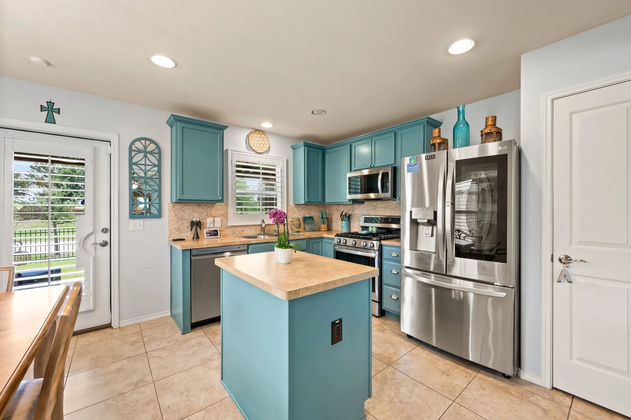 Kitchen island and view window at sink