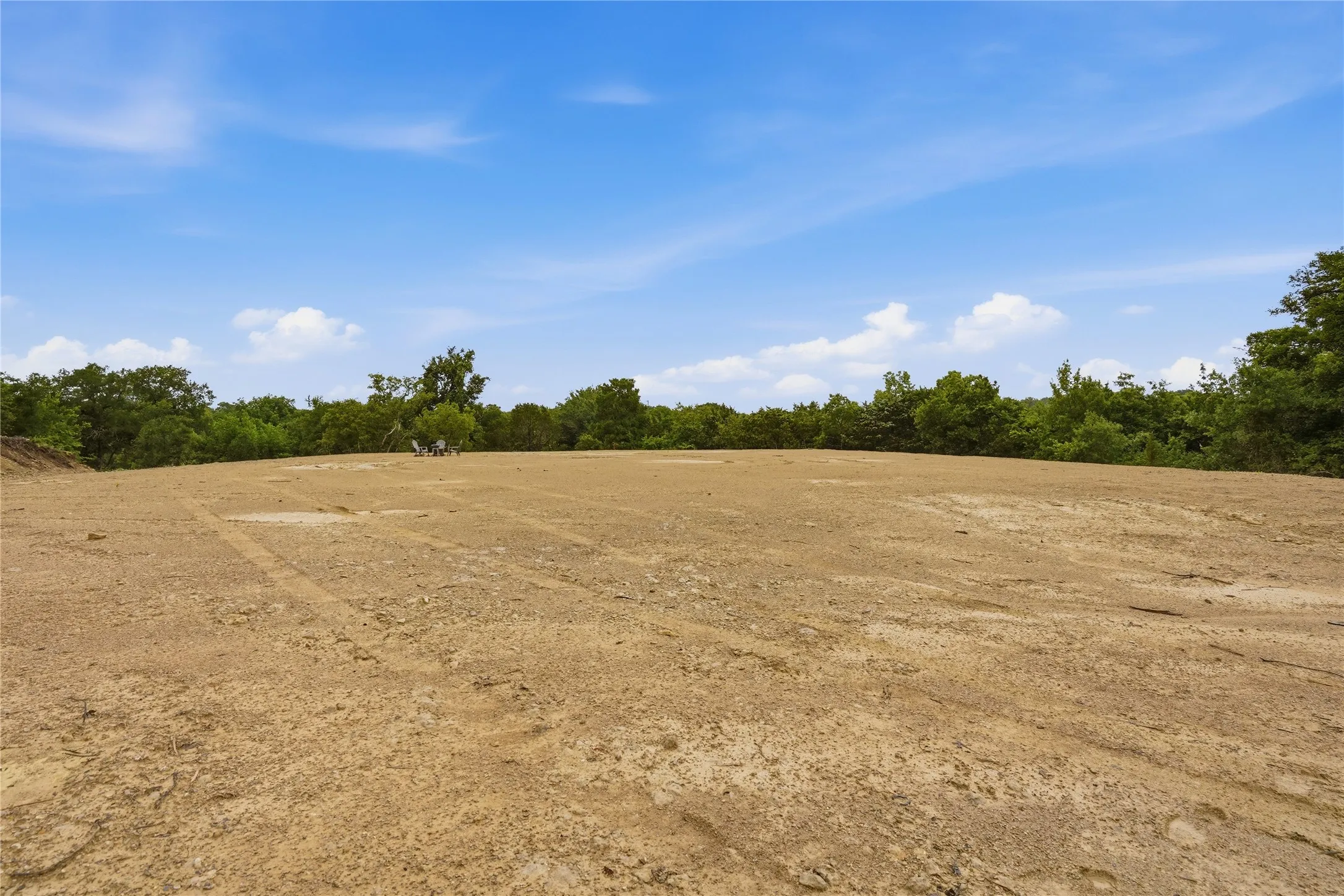 Expansive cleared building site with a level earth surface