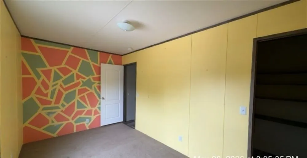 Bedroom two.  Yellow not your color?  Add a quick coat of paint to what works for you.
