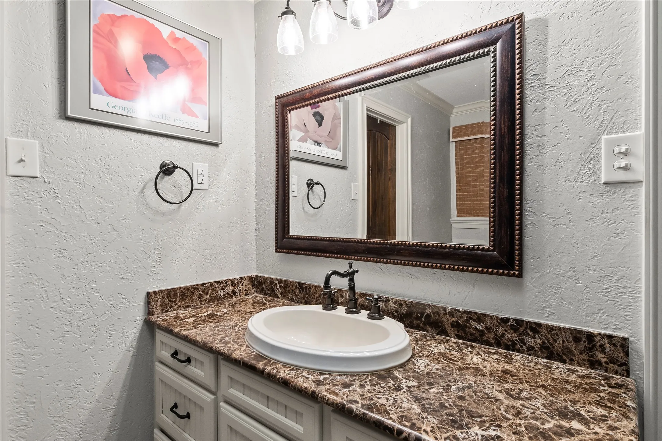 Granite Countertops, vanity with storage and skylights with walk in closet.