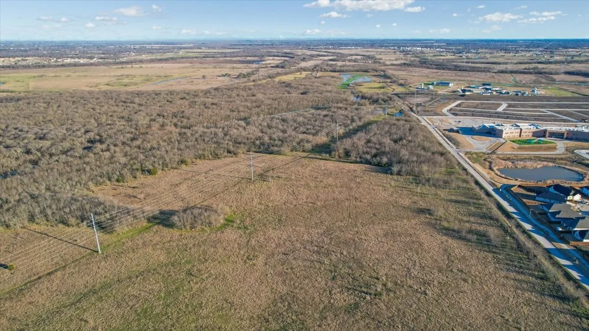 View looking East across land with Crenshaw Road frontage of 2,980.41' (see survey)