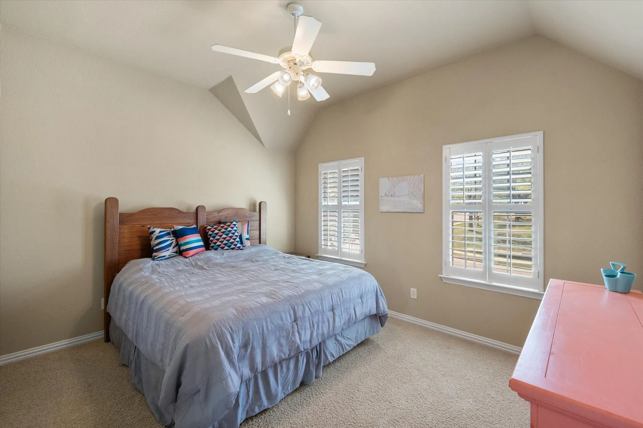 Private split fourth bedroom offering exceptional flexibility, complete with its own private bath for added comfort and convenience. Spacious layout features vaulted ceilings, abundant natural light, plantation shutters, and a ceiling fan for year-round comfort. An adjoining bonus area provides the perfect space for a home office, workout room, or hobby area, making this suite ideal for guests, teens, or multi-generational living. A versatile and functional retreat with added privacy.