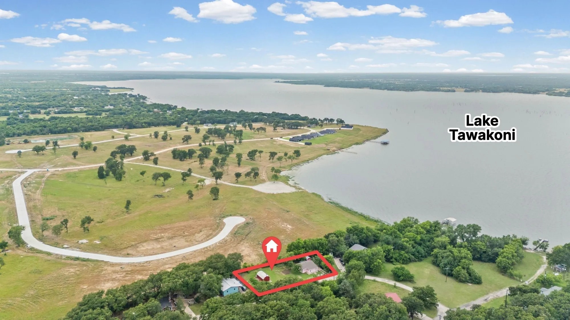 Aerial perspective showcasing a property with significant proximity to Lake Tawakoni