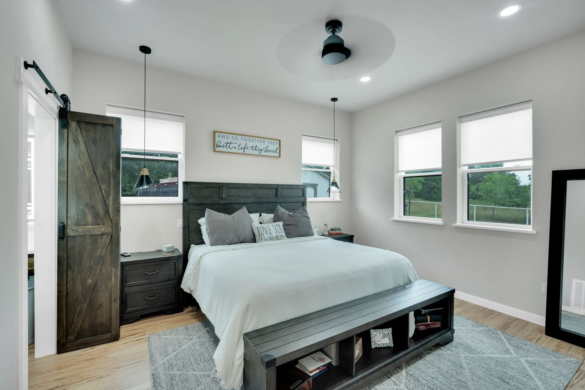 Spacious primary bedroom featuring a walk in closet, recessed lighting, and a modern ceiling fan