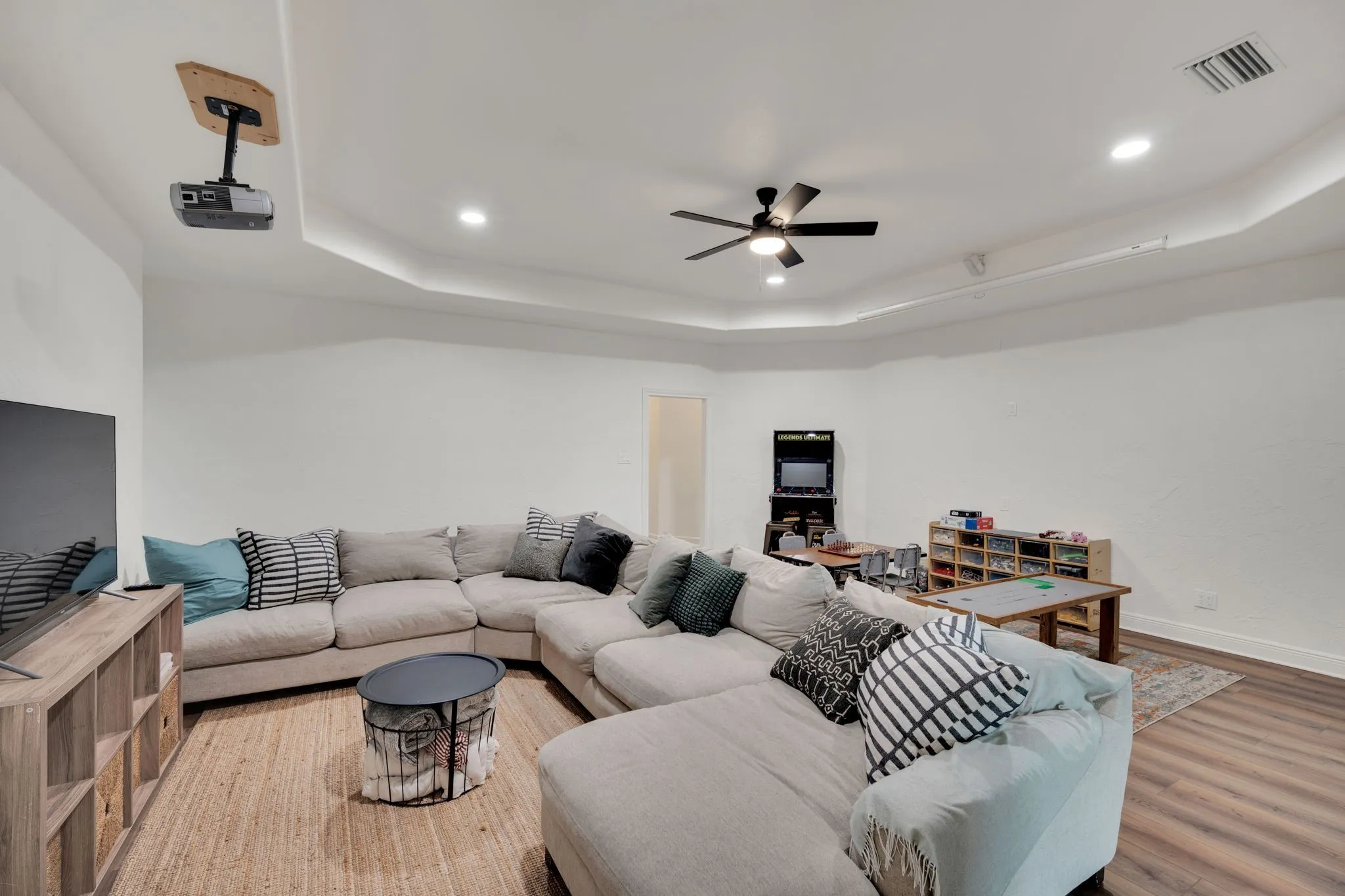 Spacious family room with recessed lighting, a ceiling fan, and plenty of space for many possibilities.