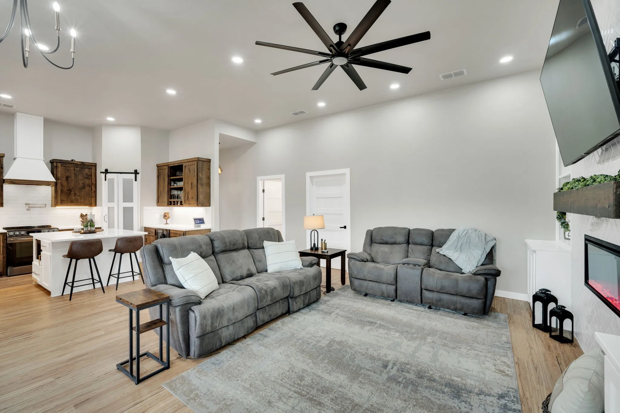 Open-concept living space featuring recessed lighting, and a contemporary ceiling fan