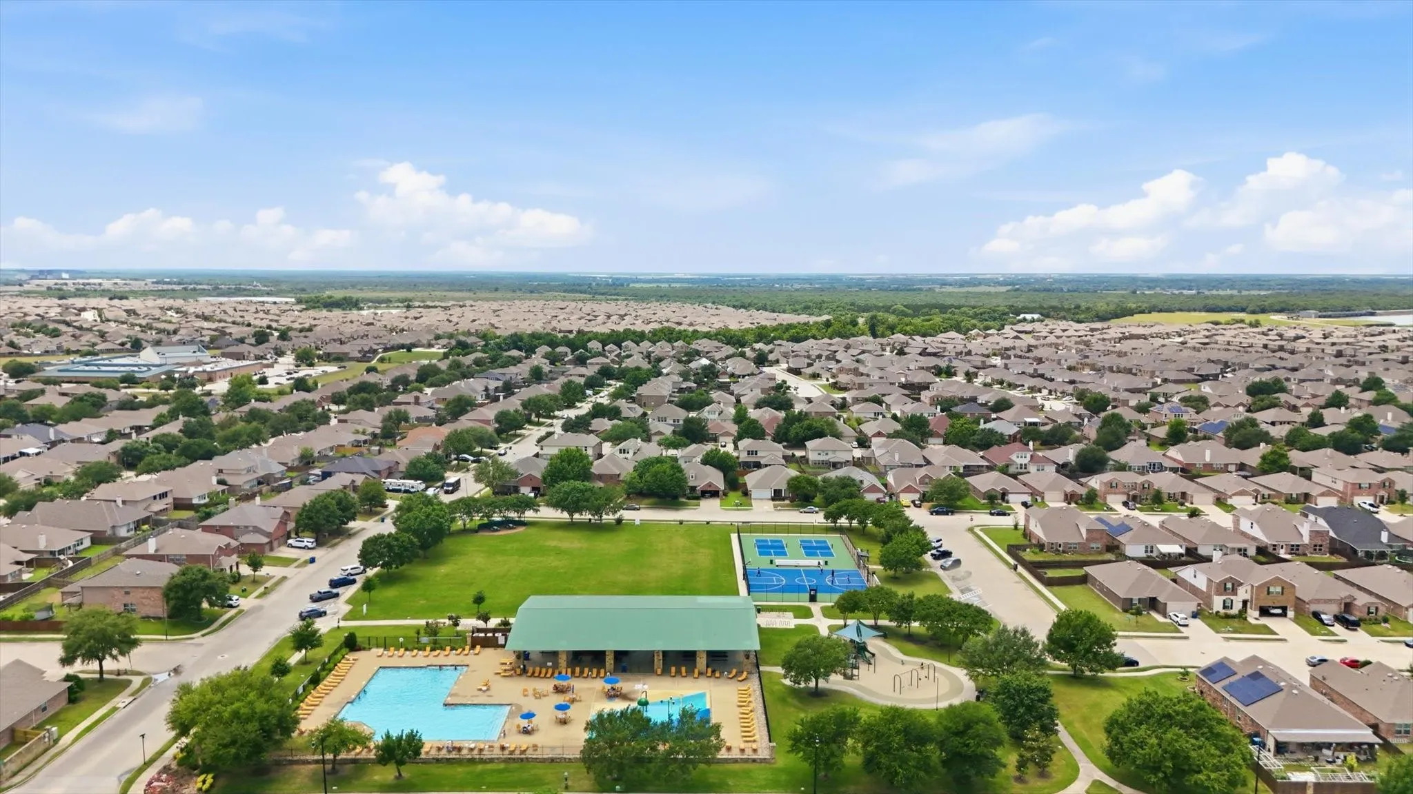 Community amenity center. Pool #1 with children's splash pad, playground, pavillion and pickleball courts.