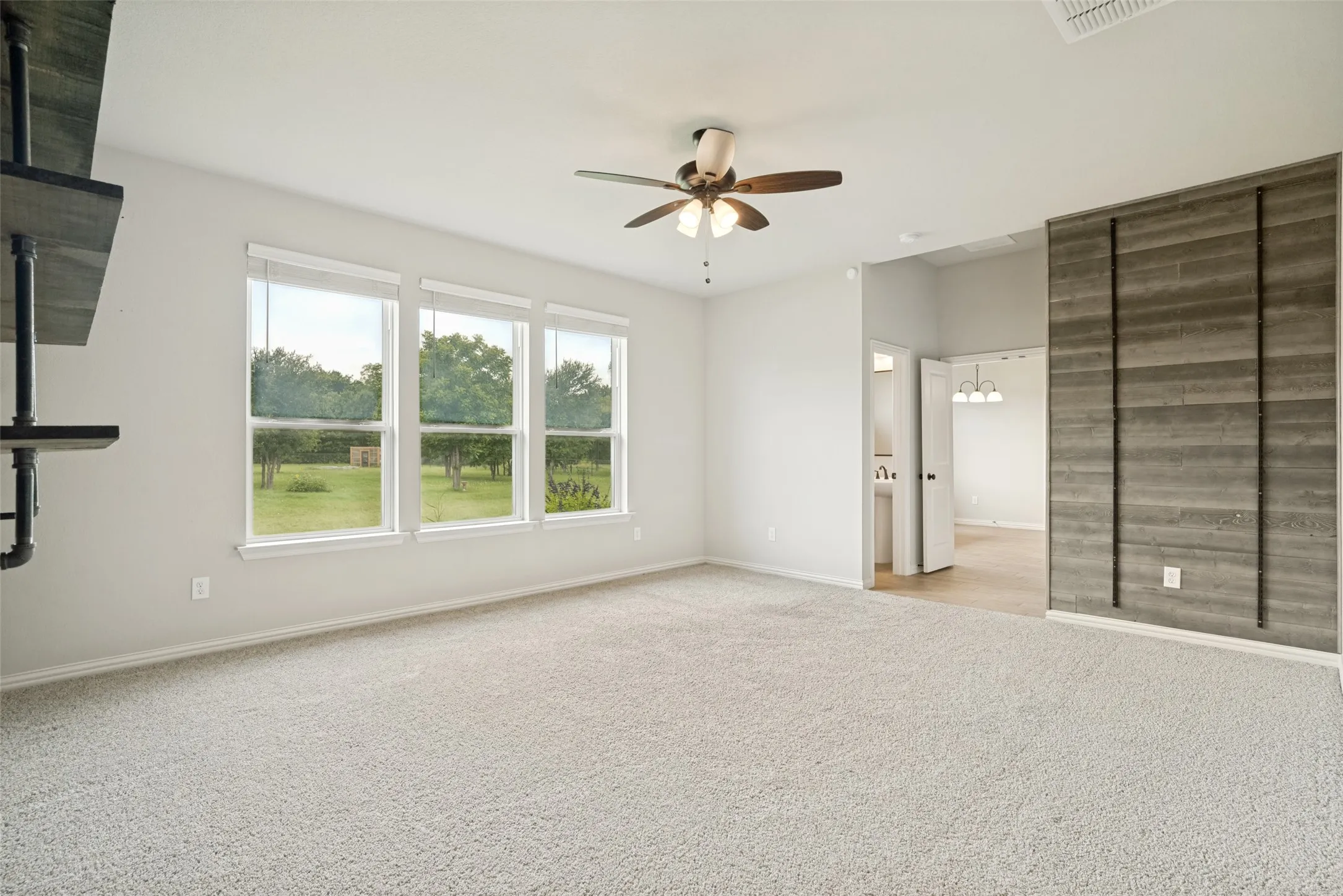 Perfect second living area with accent walls and attached powder room