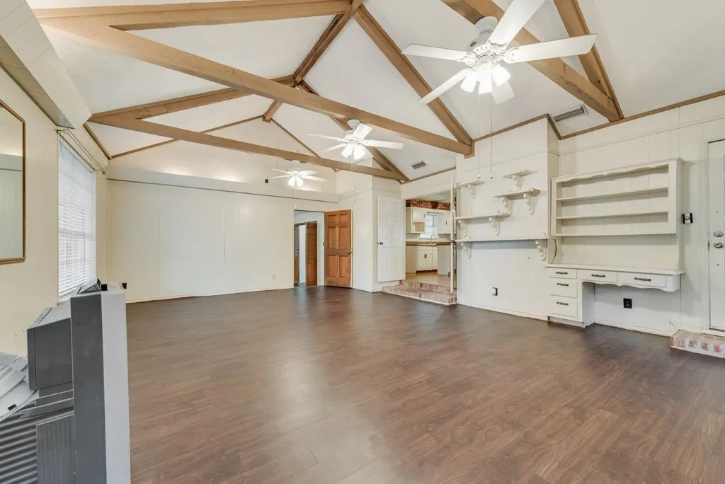 Built ins and beamed ceiling.
