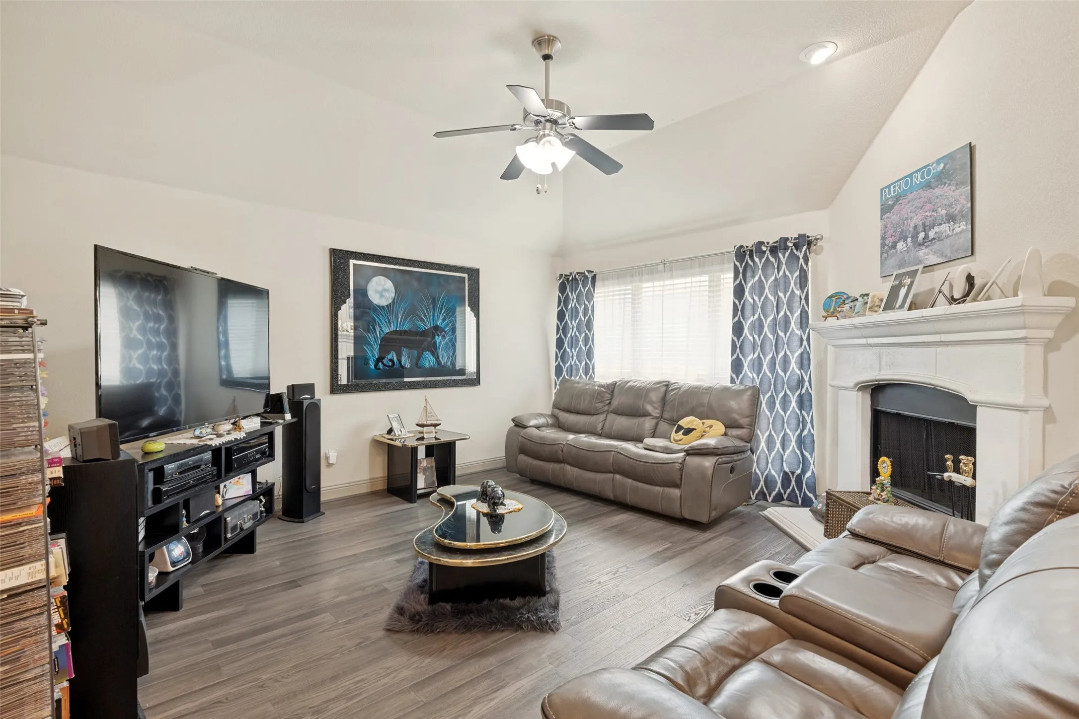 Wood flooring and cozy Fireplace.