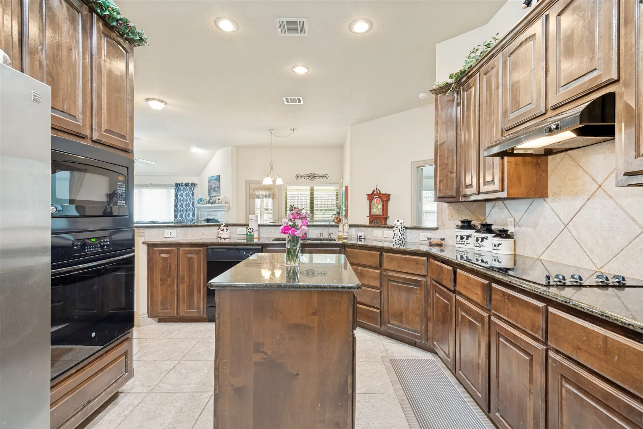 Features tile flooring plenty of Cabinets and counter space for the chef. Open concept to dining and Living