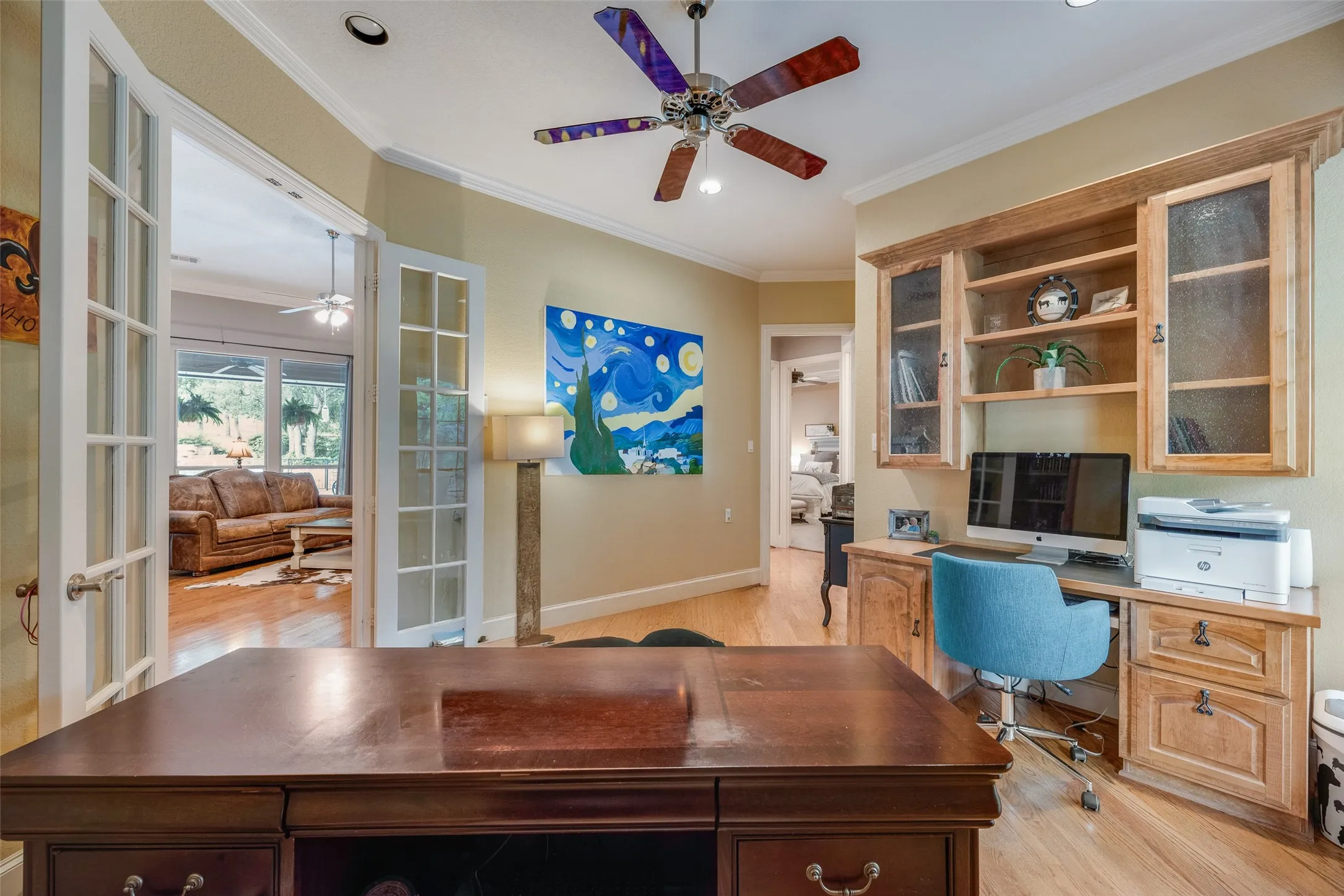 Dedicated office space featuring hardwood flooring and light-toned walls