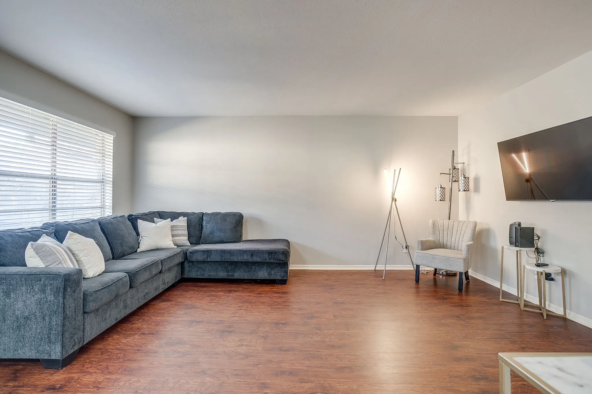 Room featuring wood-finish flooring and light-toned walls
