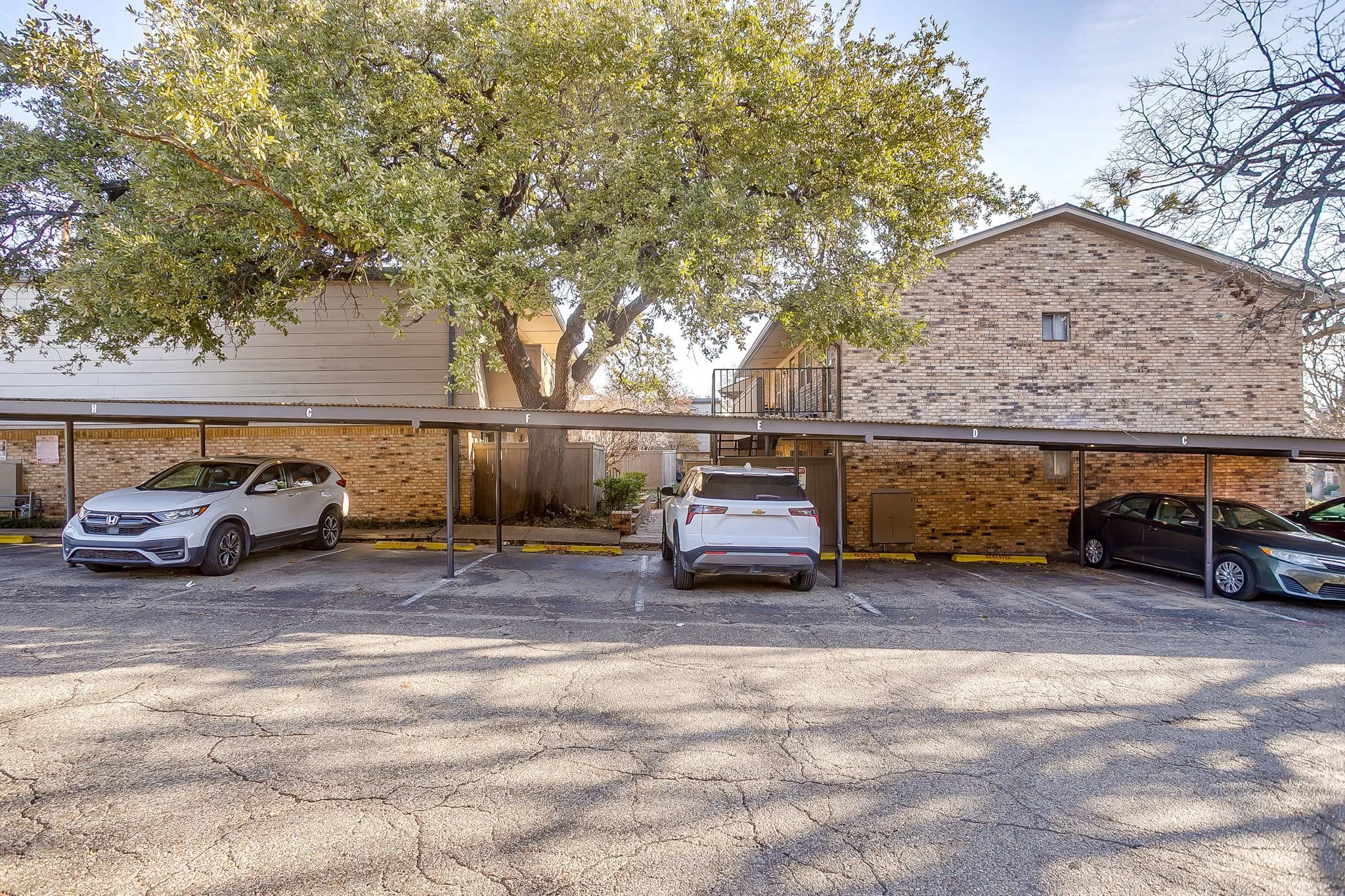 Carport parking featuring multiple covered spaces