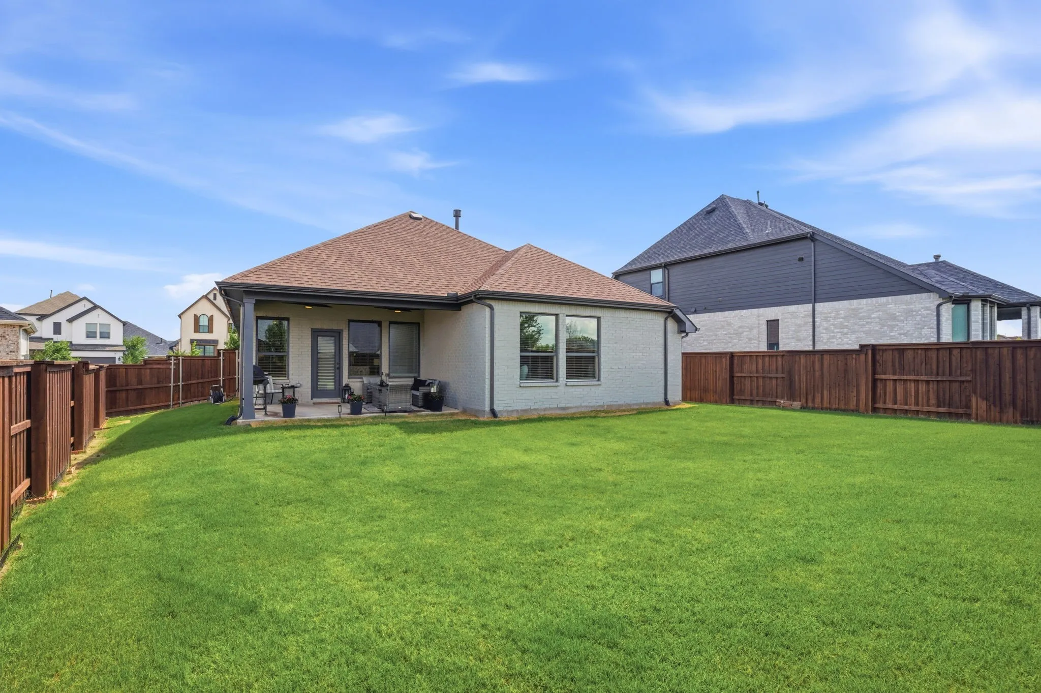 This image shows the rear exterior view of the house, specifically highlighting the back of the structure.