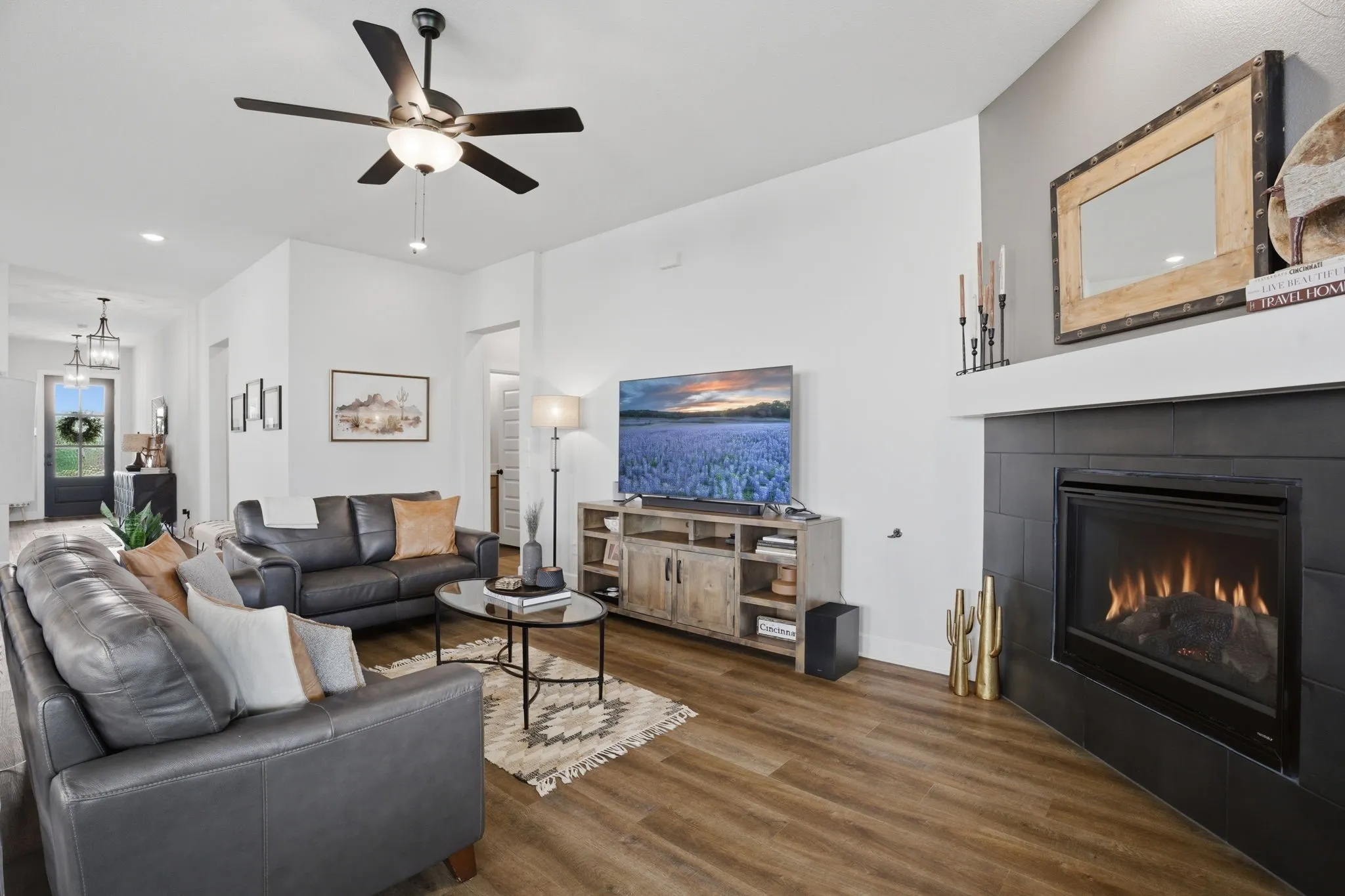 This photo showcases a different perspective of the living area, with the view directed towards the inviting entry hall, providing a sense of the home's flow and connection between spaces.