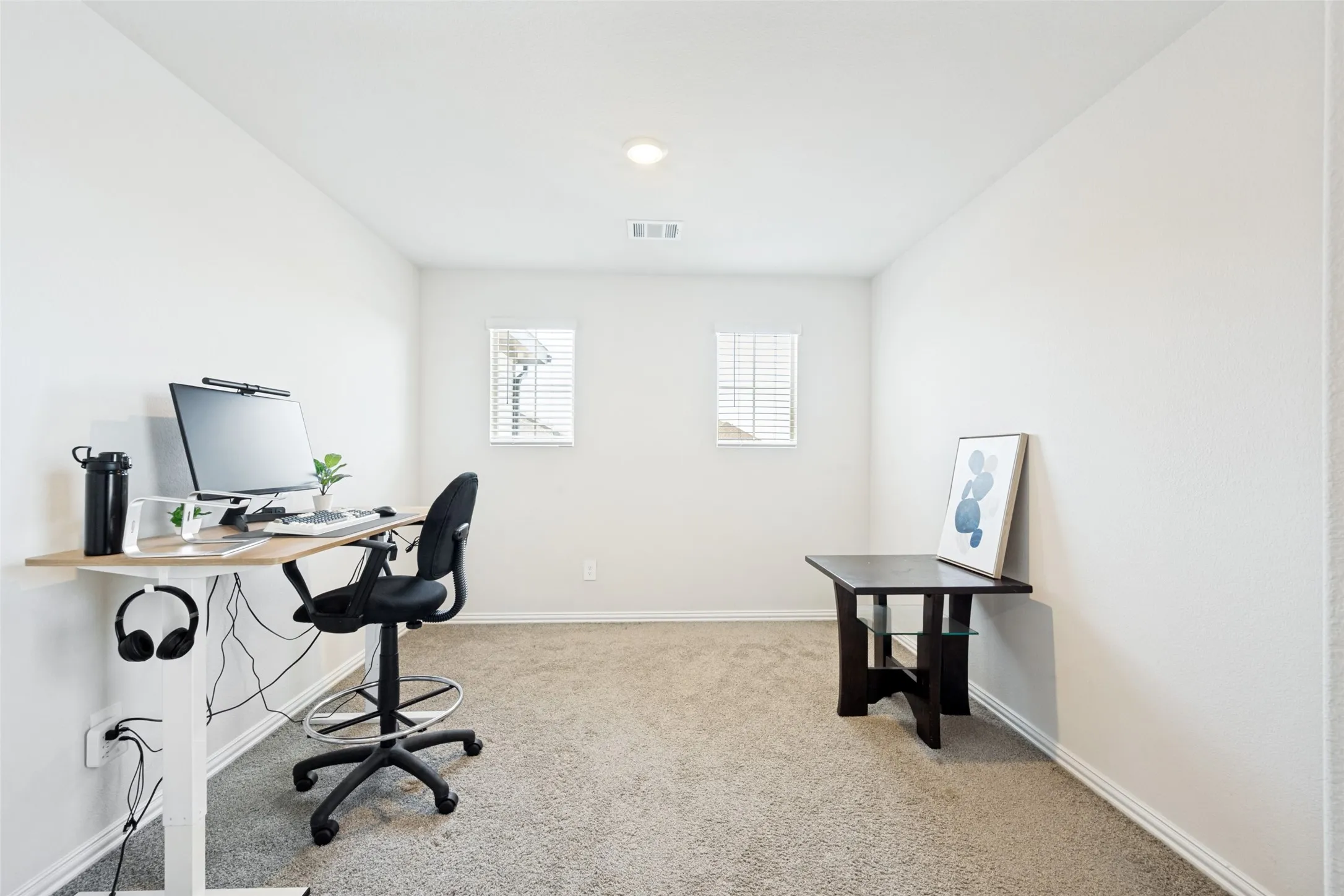 Neutral tone carpet flooring complements crisp white walls