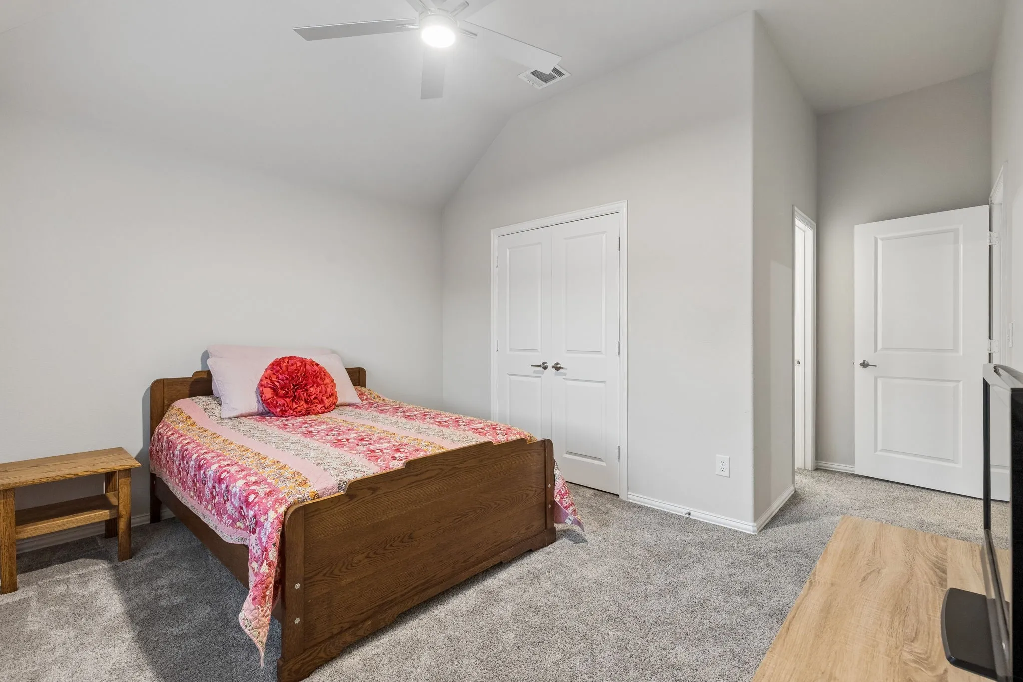 Private Ensuite Bedroom 4 w/Private Bathroom, featuring a vaulted ceiling and a ceiling fan with integrated lighting