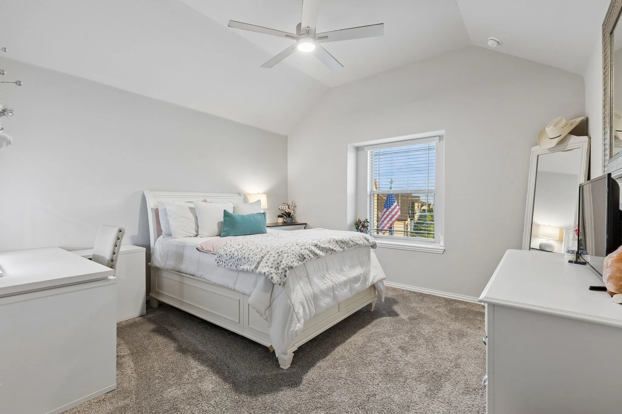 Bedroom 2, Spacious room featuring vaulted ceilings, a ceiling fan with integrated lighting, window with blinds, and neutral-toned carpeting