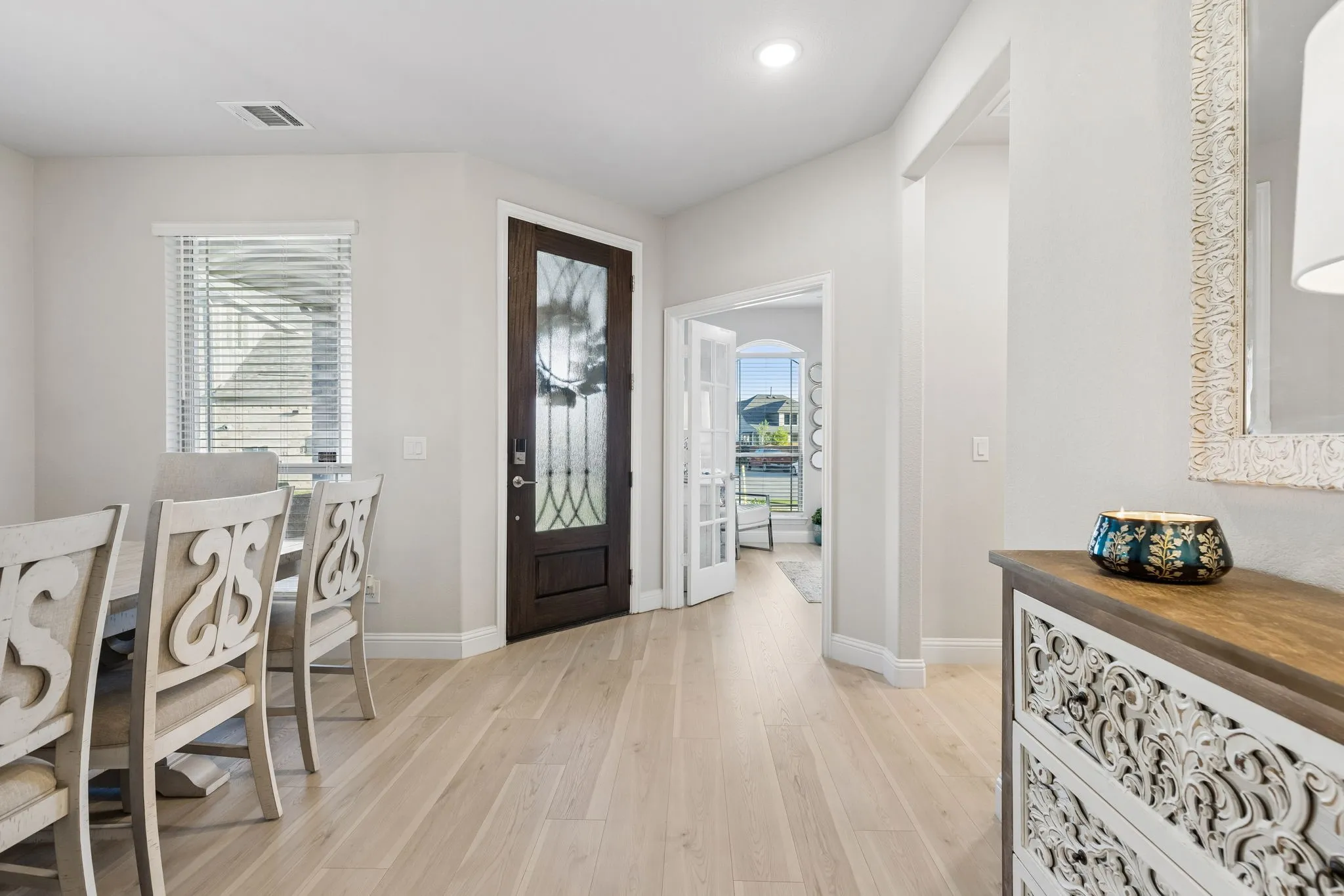 Wood-finish flooring extending from the entry to internal spaces just off home office and dining room