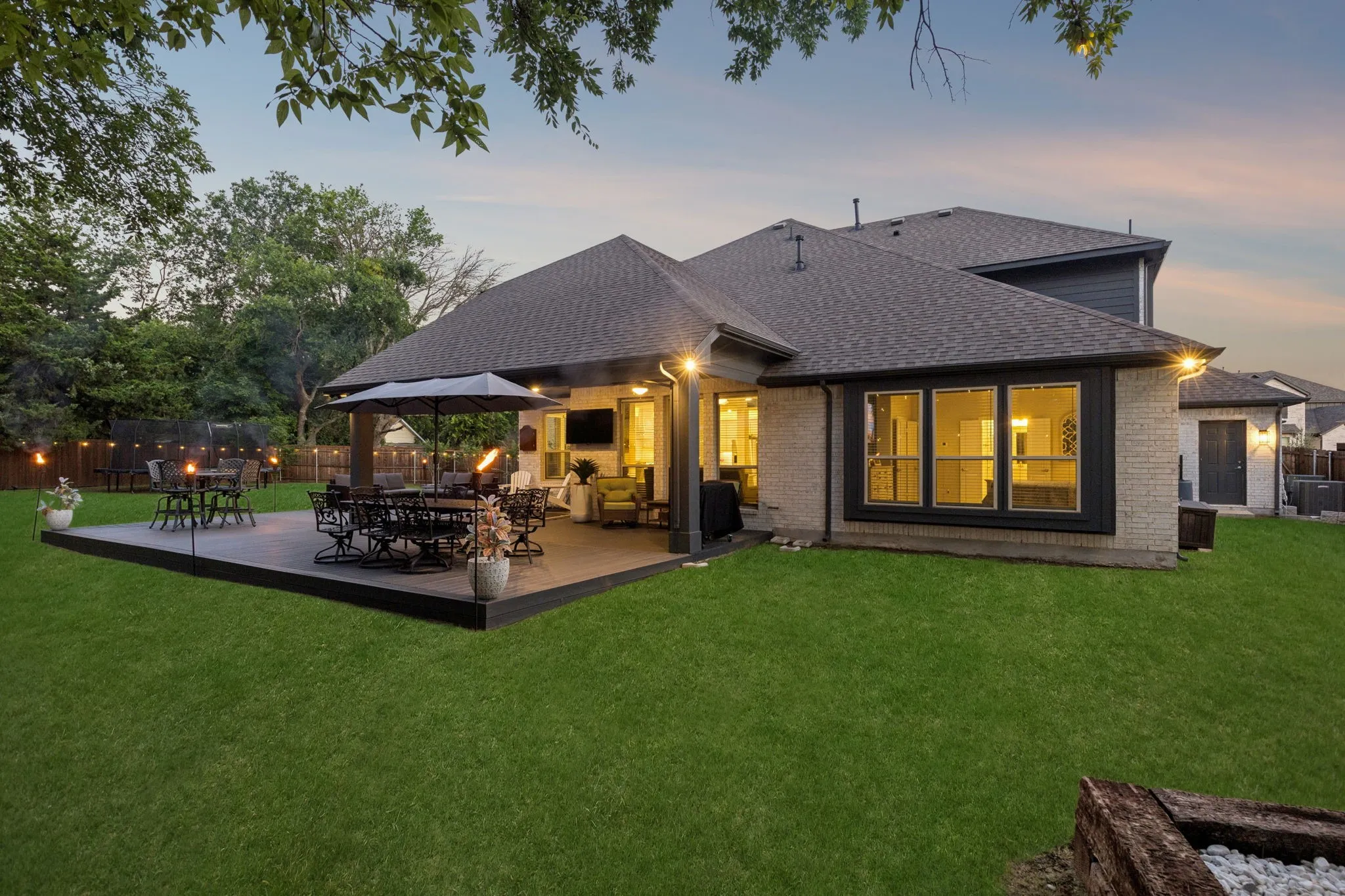 Back Extended Spaciuos Patio with fans and lighting.  Plenty of space for outdoor dining and BBQ area.