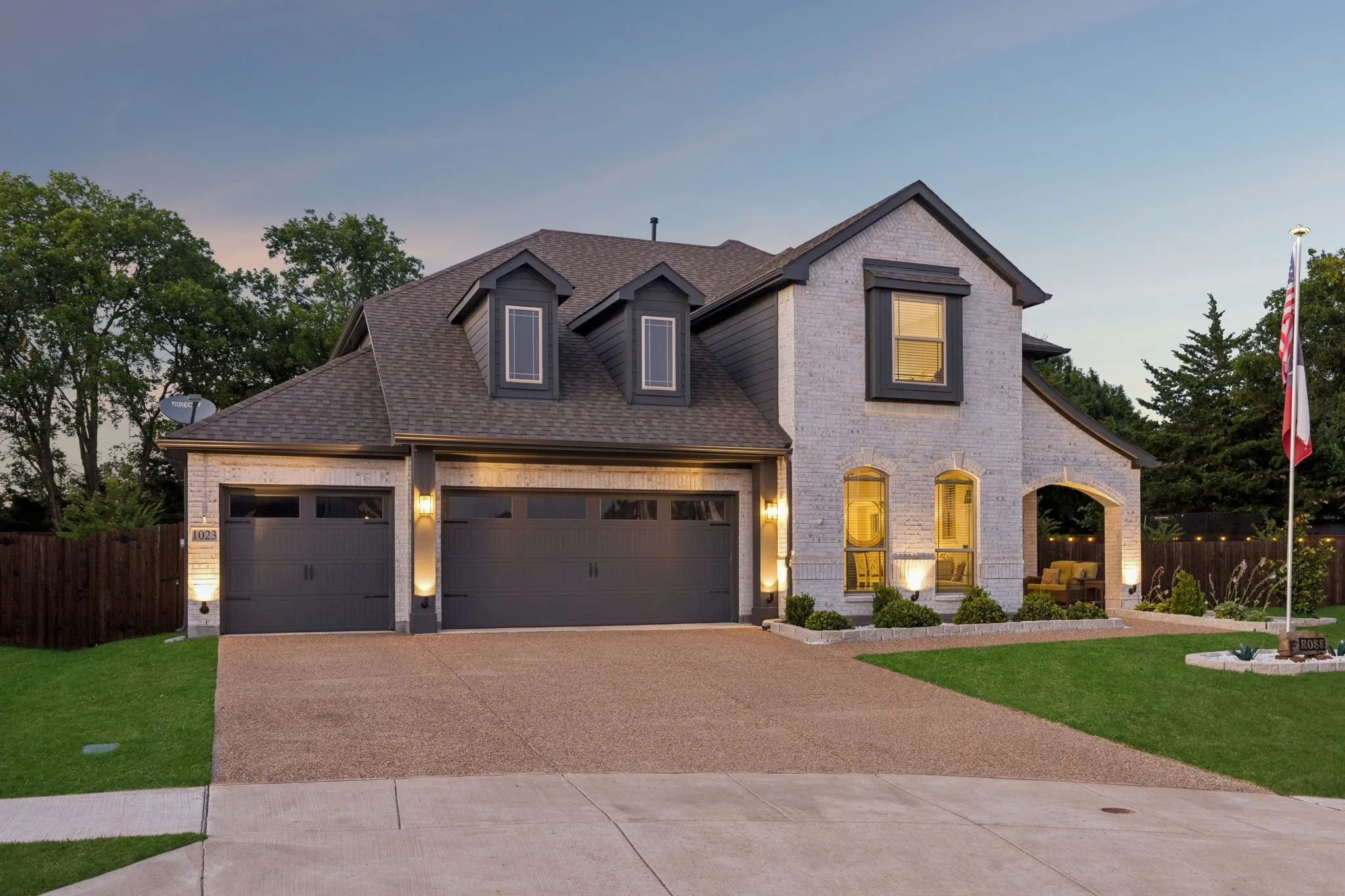 Front house, featuring 3 car extended garage with ample storage space and room for freezer, shop and refrigerator.  Beautiful outdoor lighting to showcase the home.