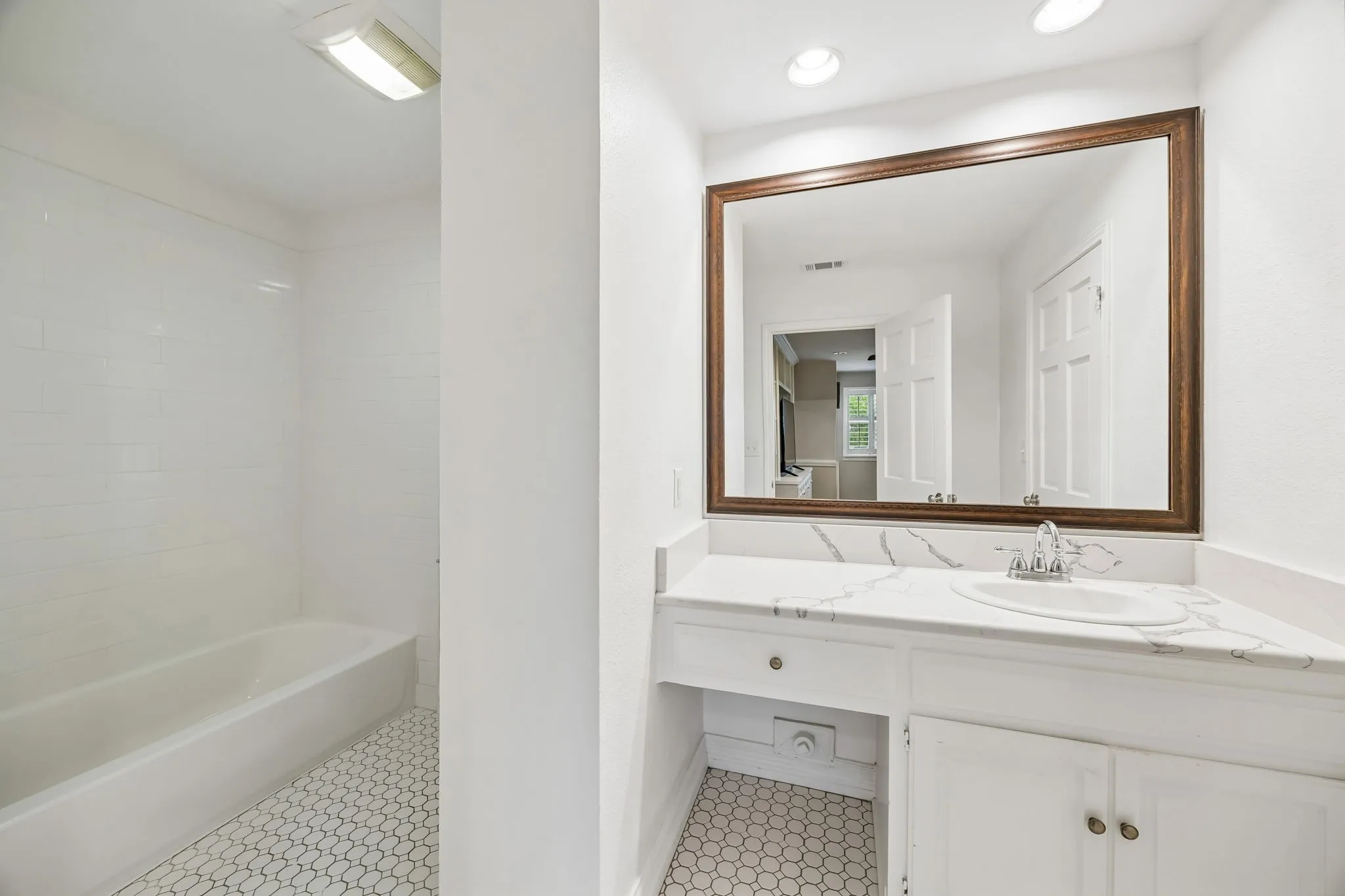 Second full bath upstairs with a combination tub and shower.