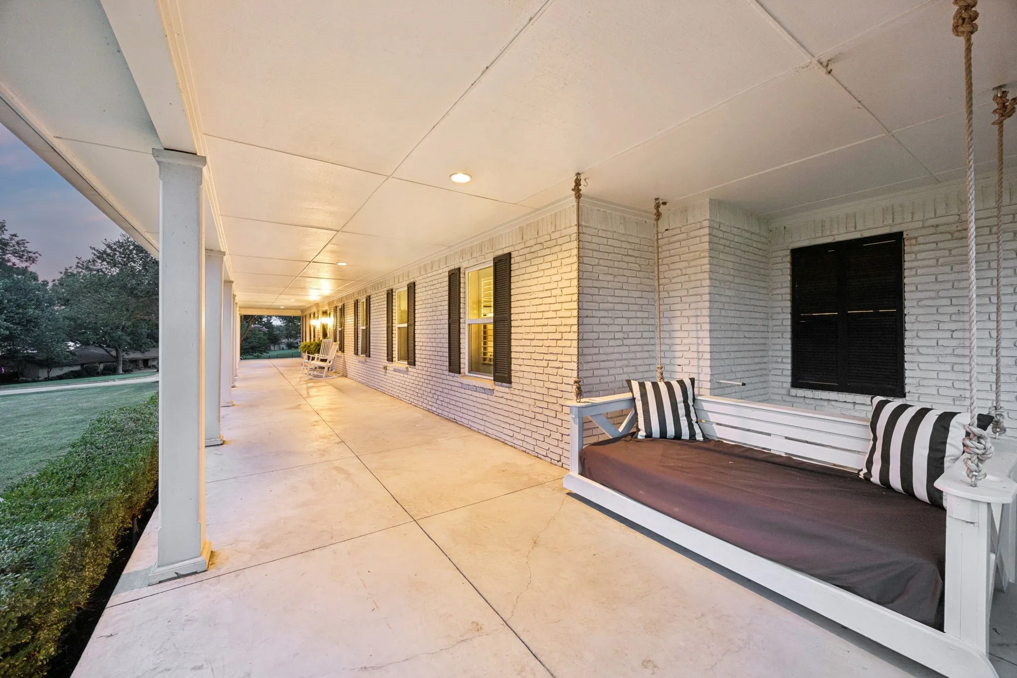 Watch amazing sunsets from the covered front porch which extends the entire length of the home.