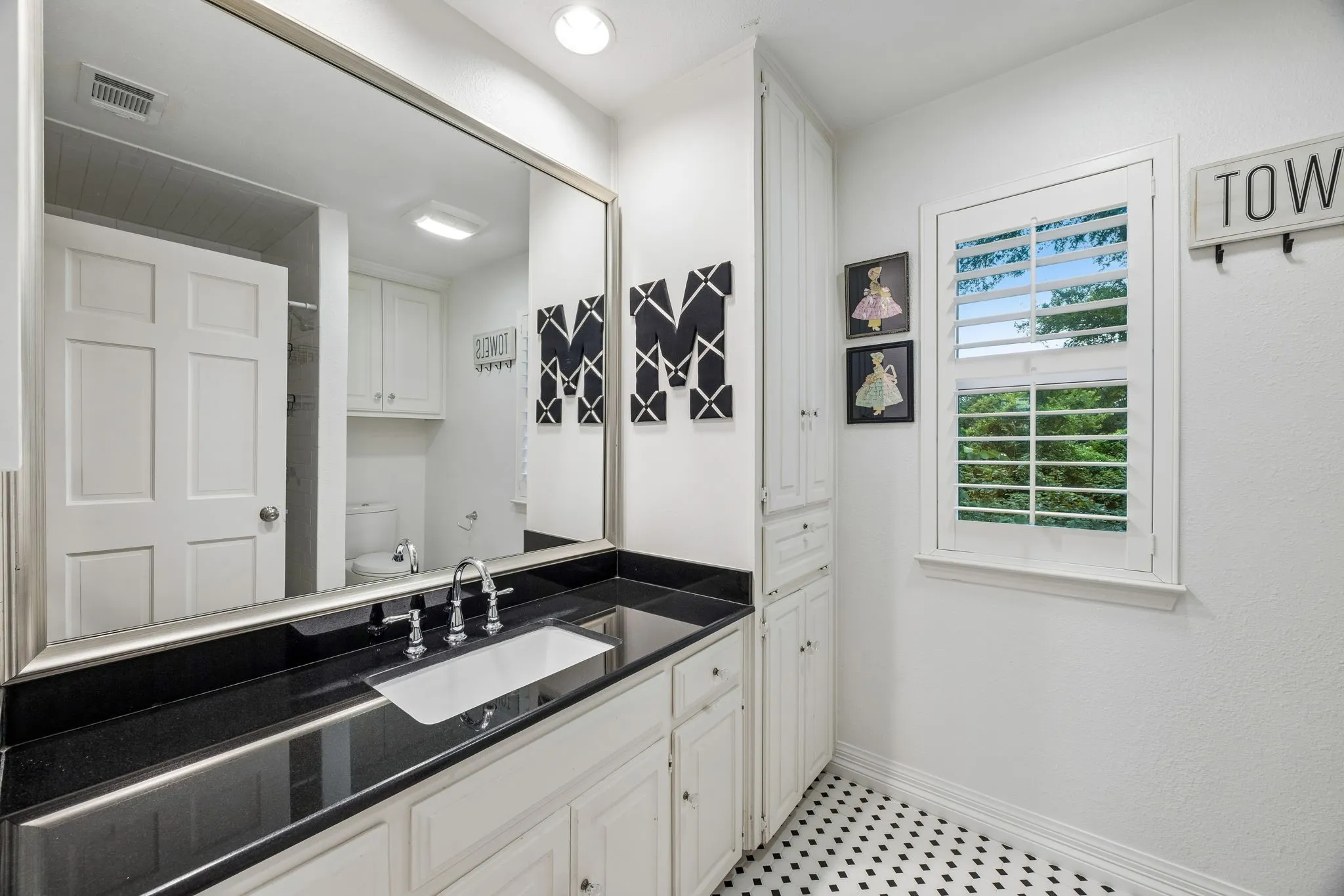 One of 2 full baths upstairs with shower