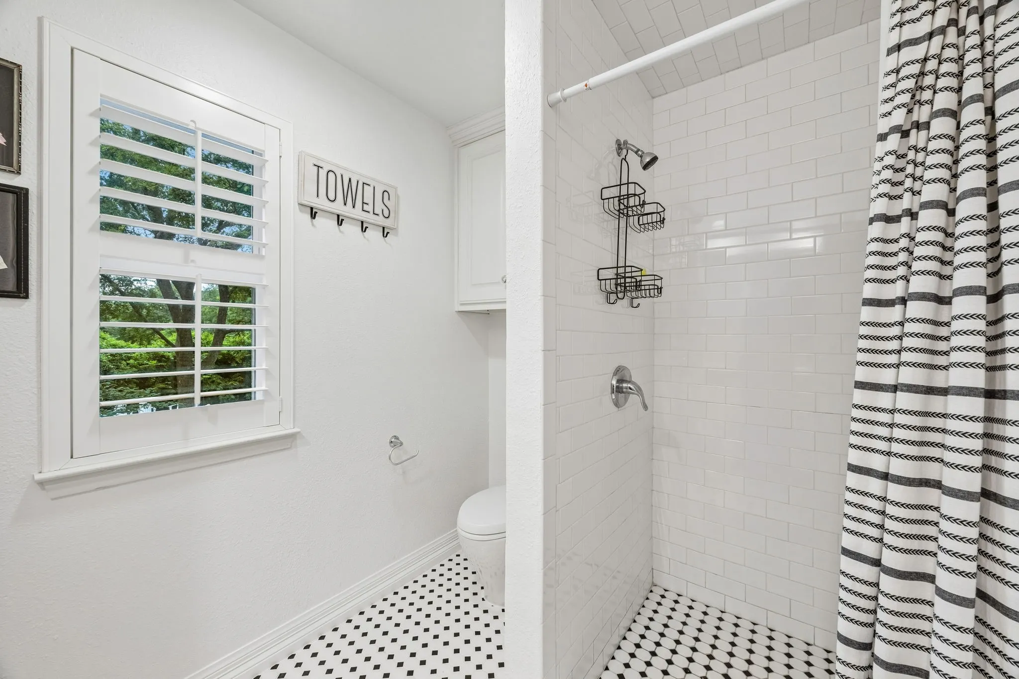 This bath features a large shower.