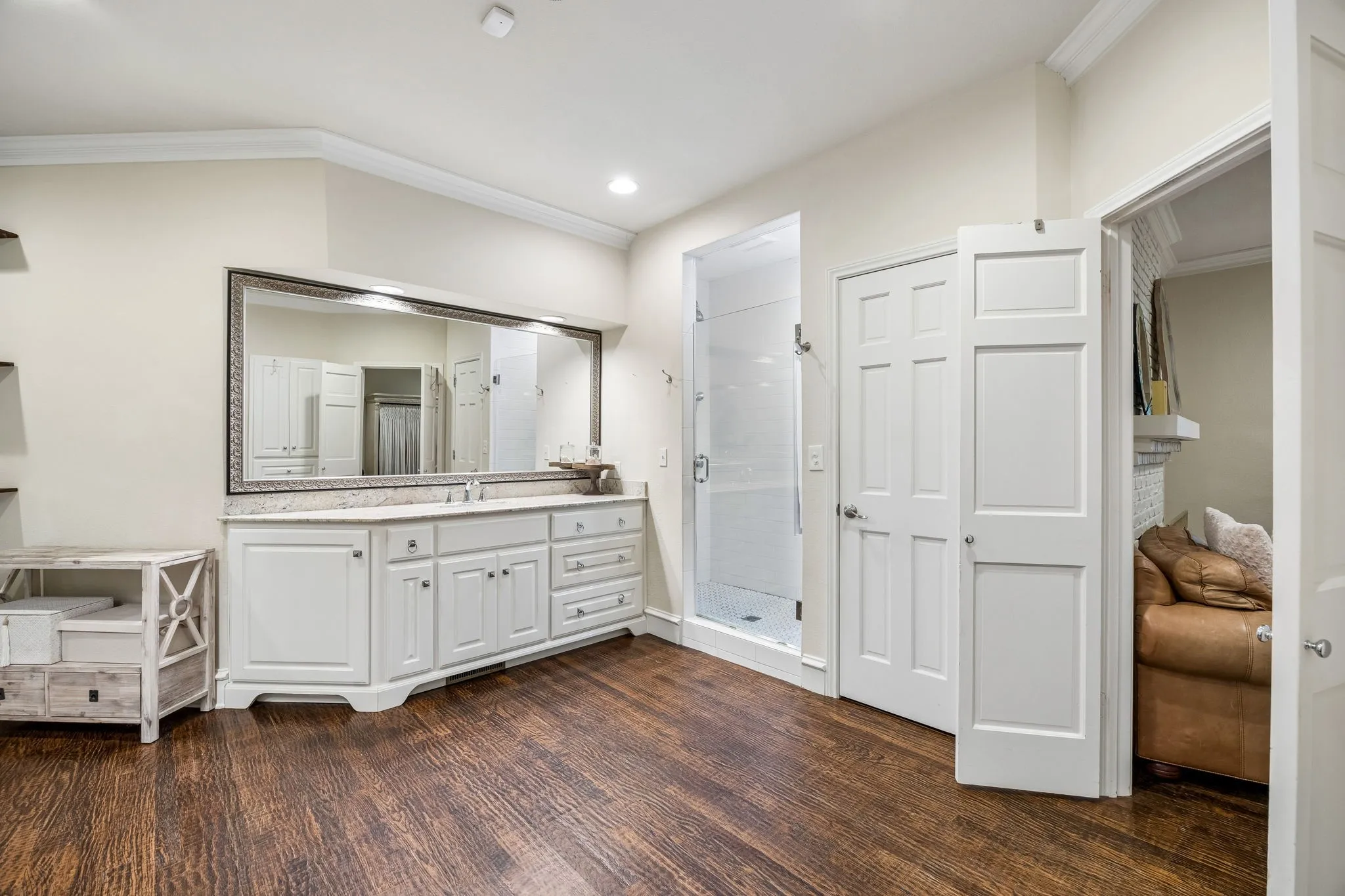 The primary bath also features a large walk-in shower.