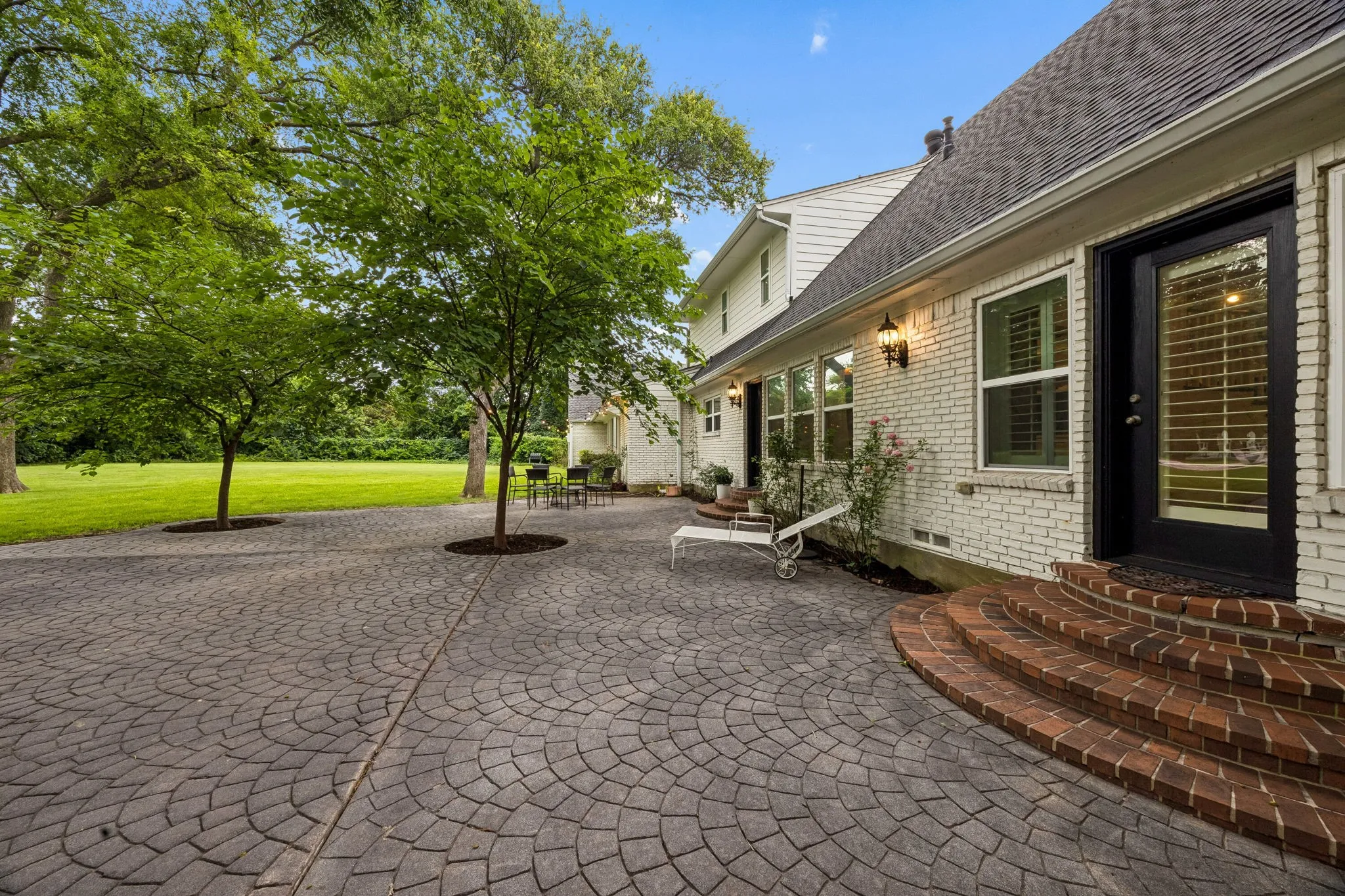 Another look at the expansive patio in the back made with decorative pavers.