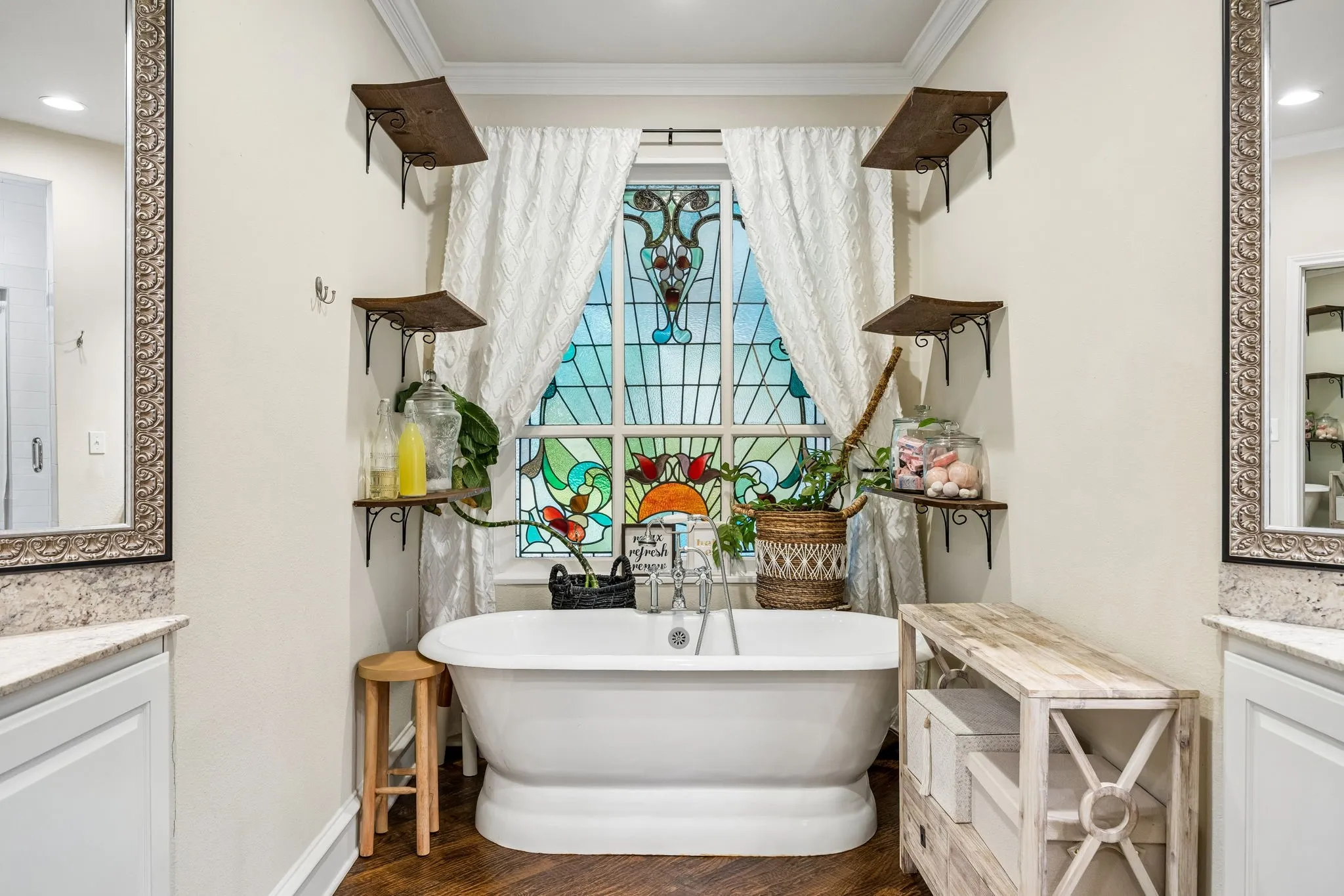 Time to relax in this garden tub with stained glass background.