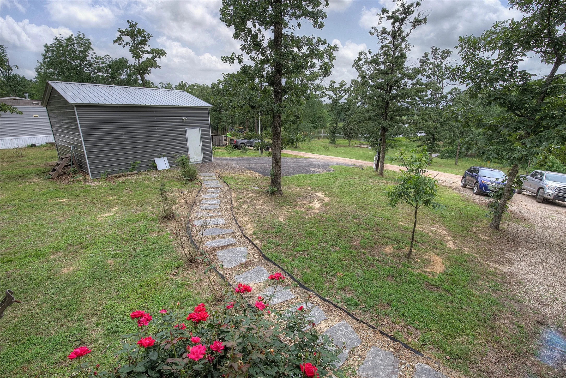Flagstone path to your separate​​‌​​​​‌​​‌‌​‌‌​​​‌‌​‌​‌​‌​​​‌​​ garage/workshop.