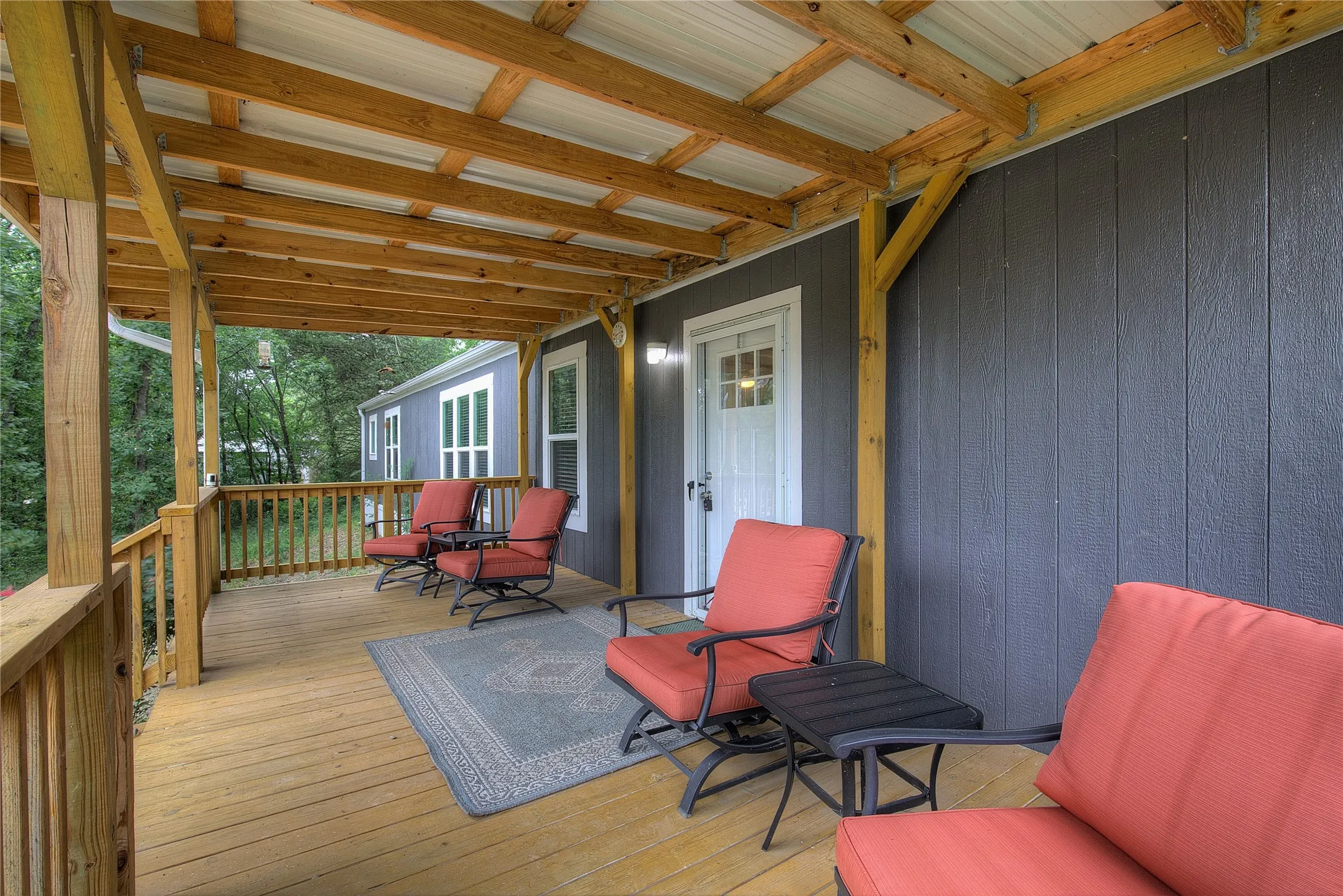 Another view of spacious covered front porch