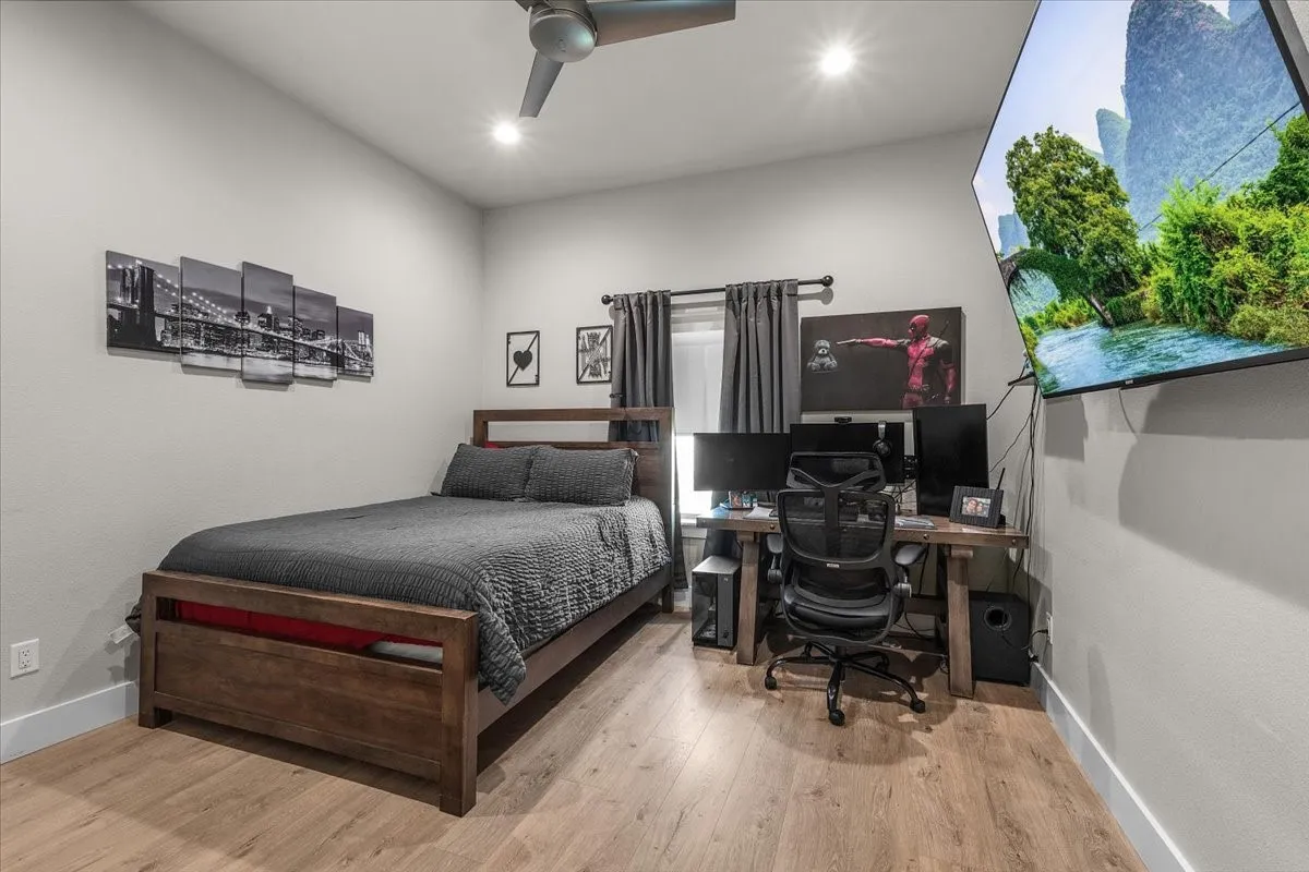 Bedroom featuring ceiling fan and recessed lighting.