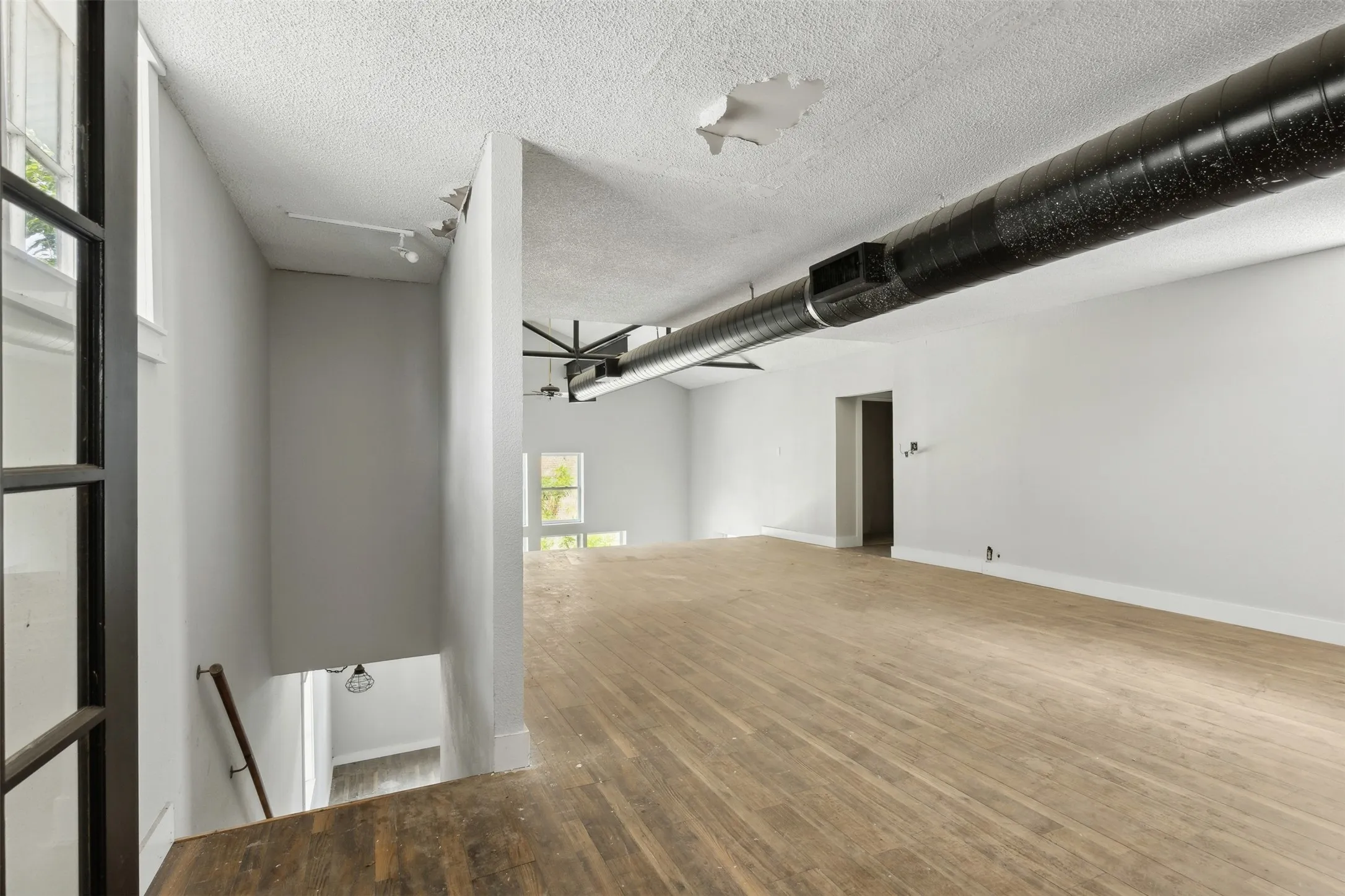 *French-doors in-between the two rooms upstairs. Two sets of stairs to access the second floor. * Bathroom capability on this side.
