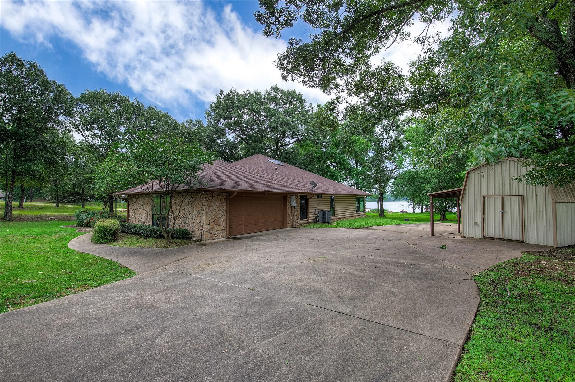 two-car attached garage with storage shed
