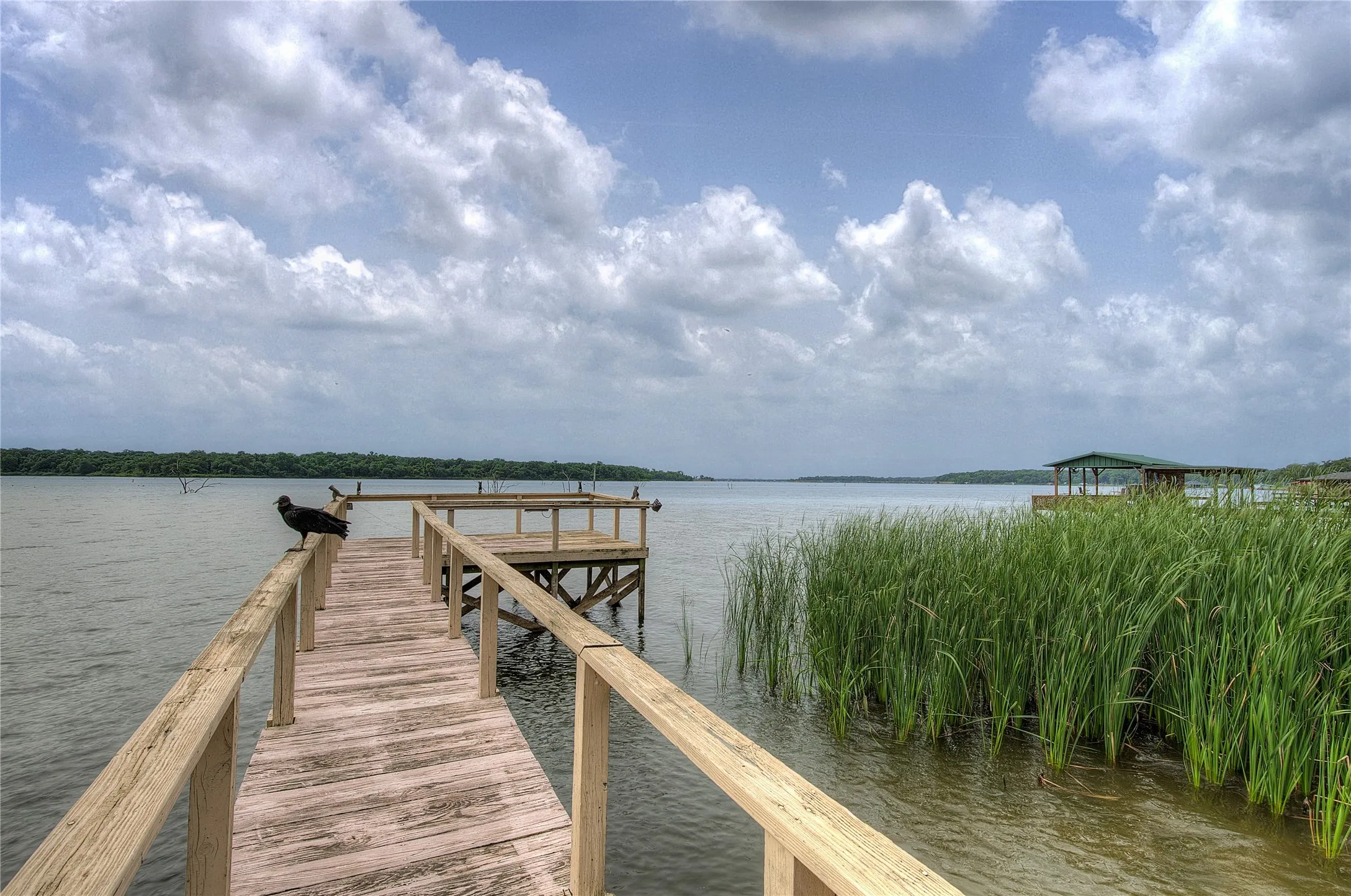 The dock from the boathouse out to your private fishing deck