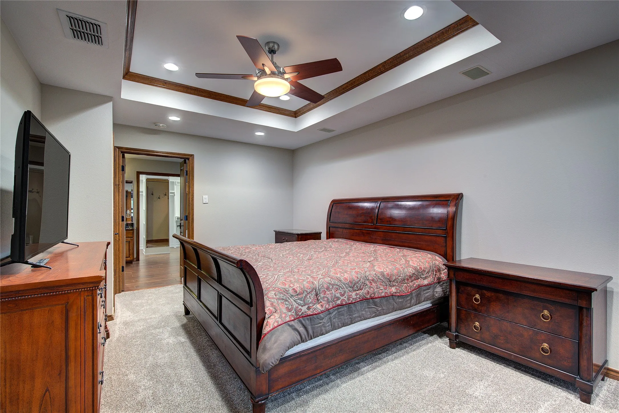 Primary suite has trey ceiling, ensuite bath, sitting nook