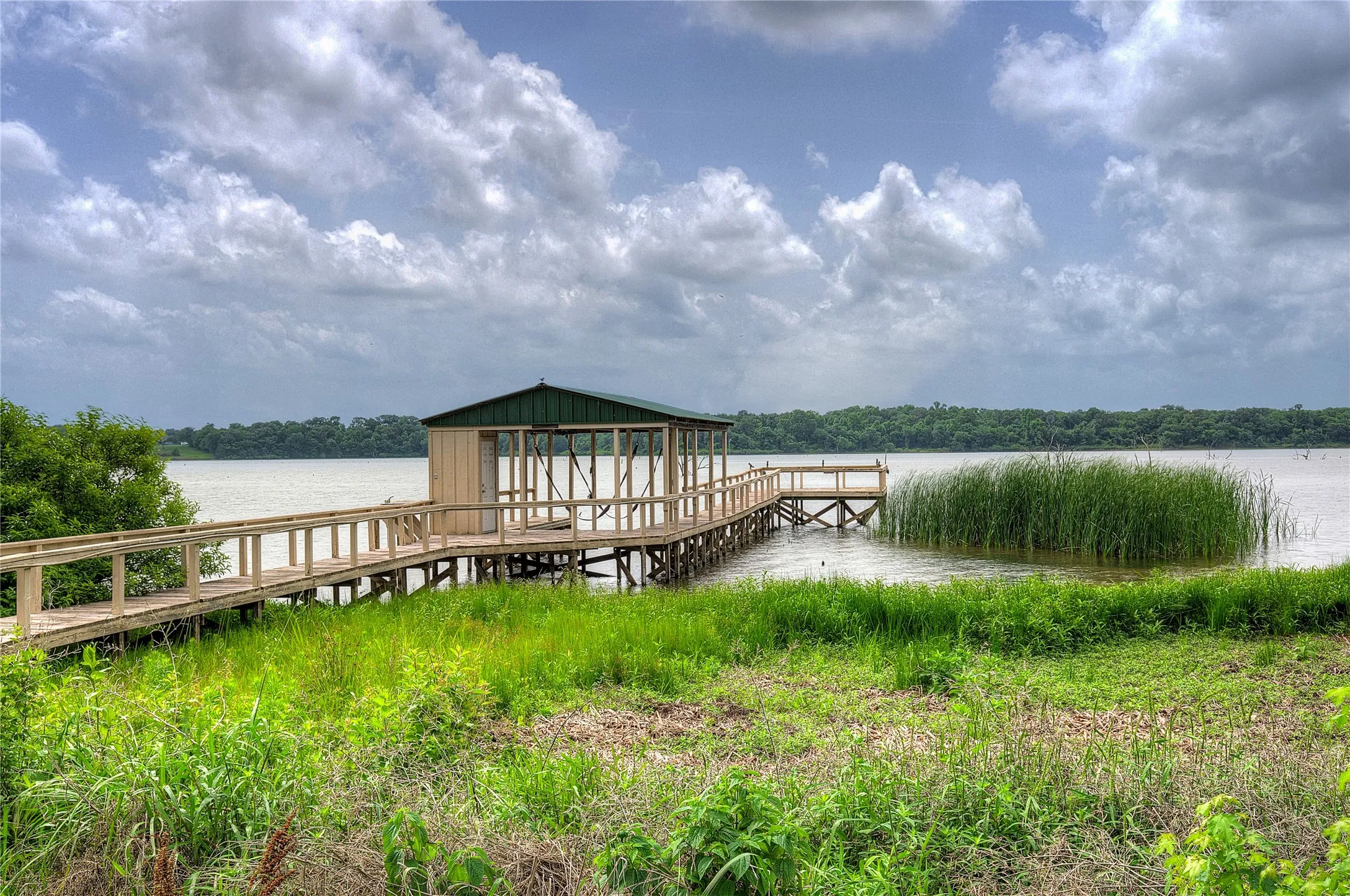 Your private dock has covered power boat lift, storage closet, fish cleaning station and deck over the water.