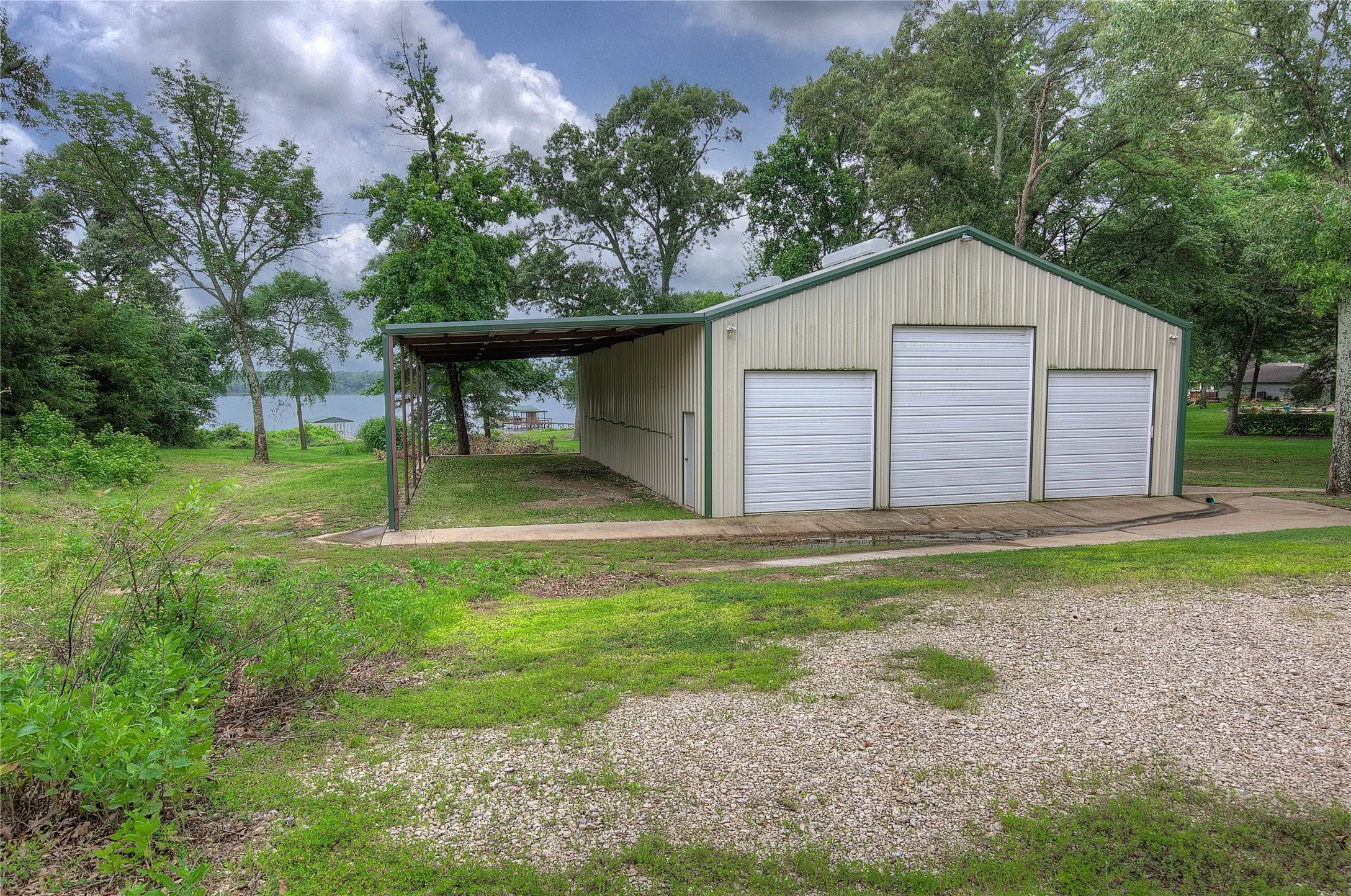 60x40 workshop with 60x20 overhang. 4 total roll-up doors, one large enough for RV.