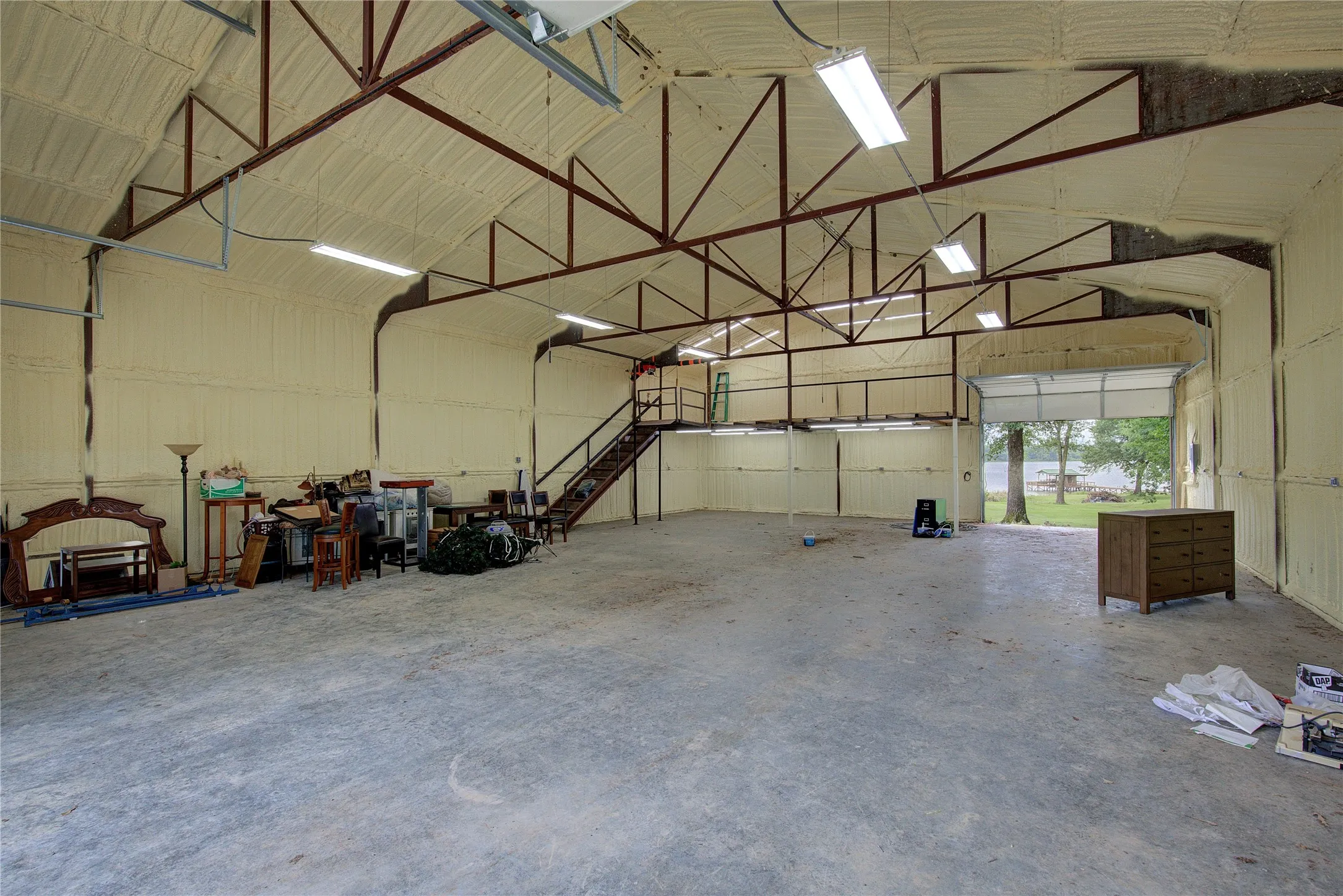 Shop has closed-cell spray foam insulation, concrete slab, loft with power lift.