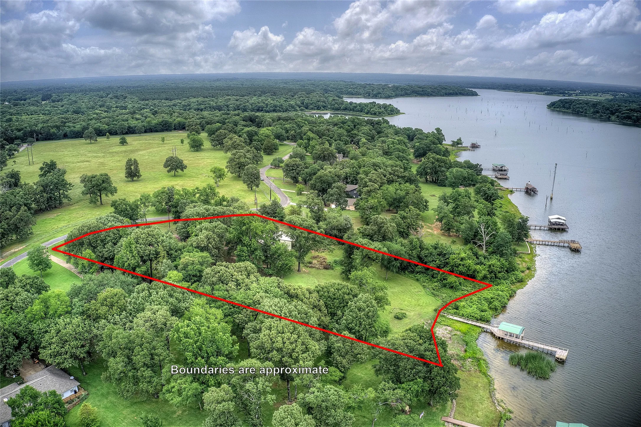 THREE lots on Lake Fork with huge shop and private dock.