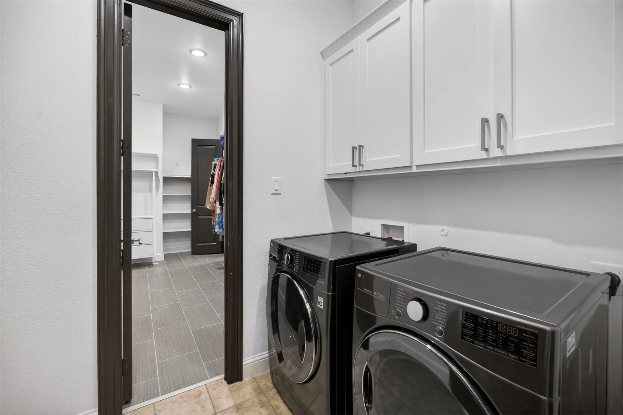 Laundry room connects to primary bedroom for convenience
