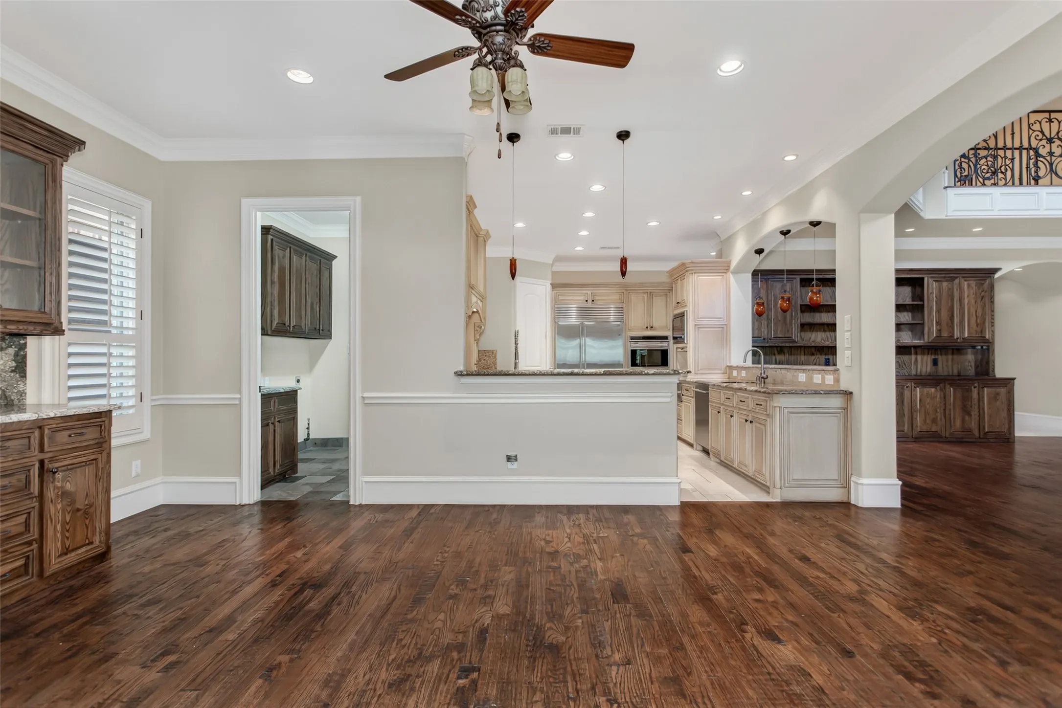 Spacious breakfast area with custom built-ins, abundant natural light, and seamless access to the kitchen, living room, and outdoor entertaining spaces.